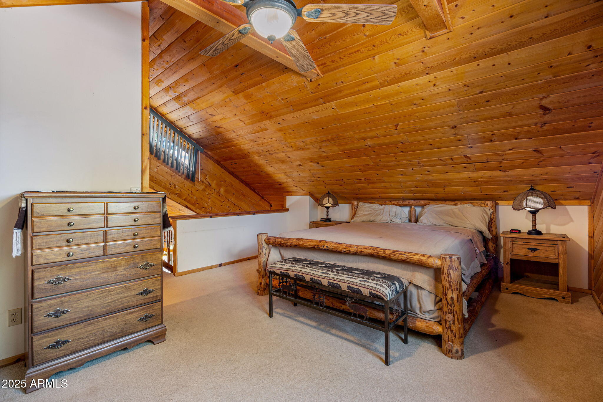2240 Roundabout Way Overgaard, AZ 85933 - Photo 23 of 47 a spacious bedroom with a bed and a cabinets