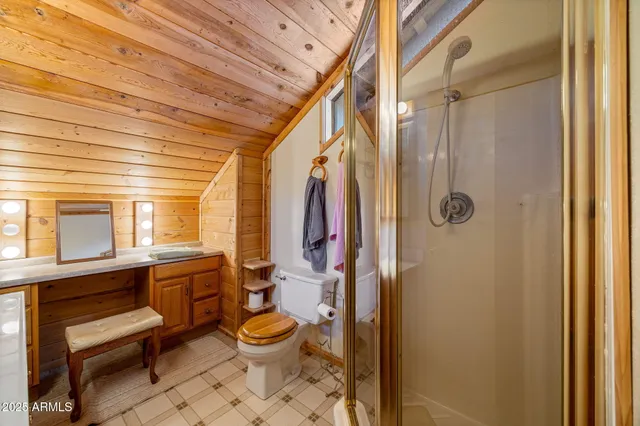 a bedroom with two beds and a chandelier