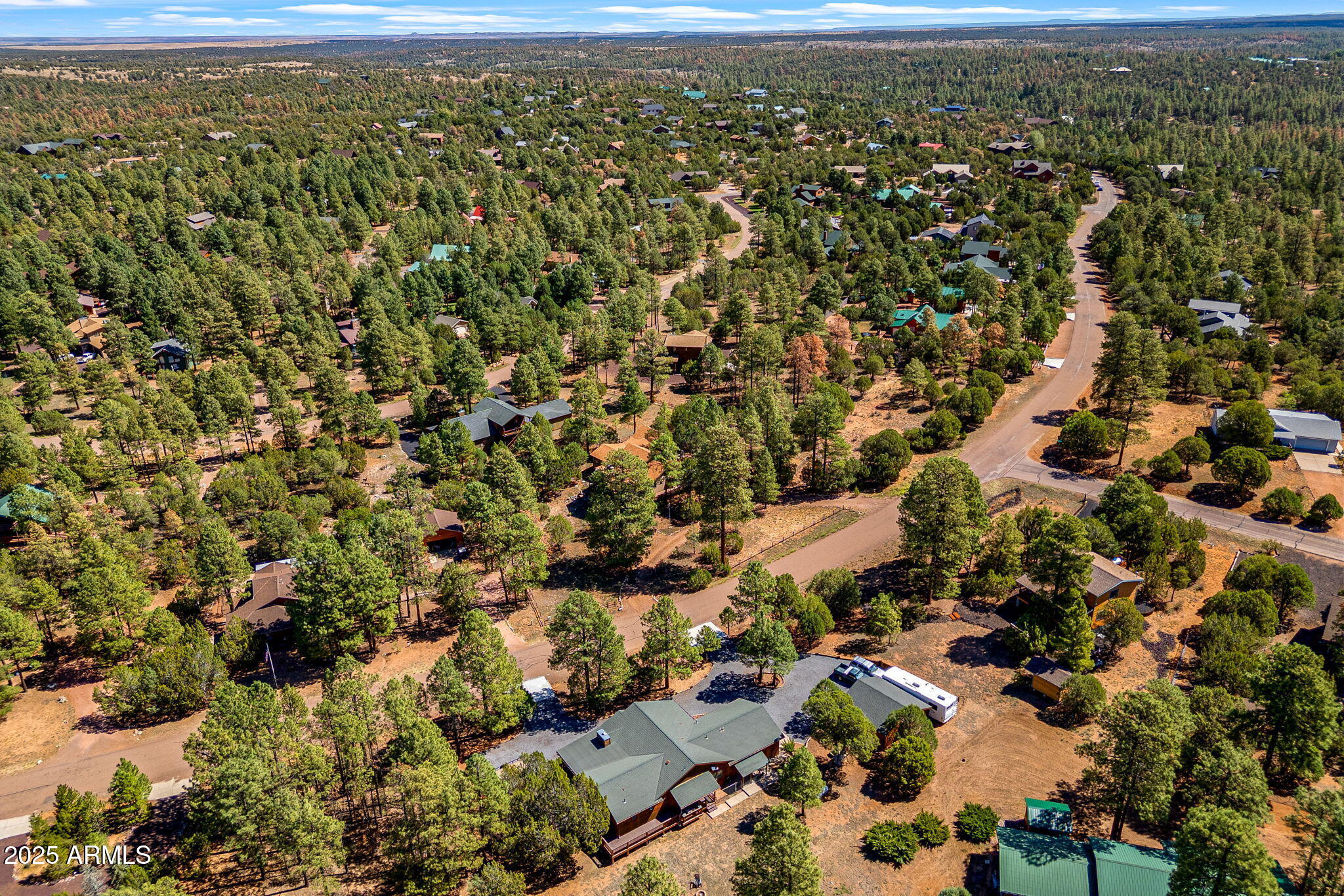 2240 Roundabout Way Overgaard, AZ 85933 - Photo 37 of 47 an aerial view of residential house with parking and trees