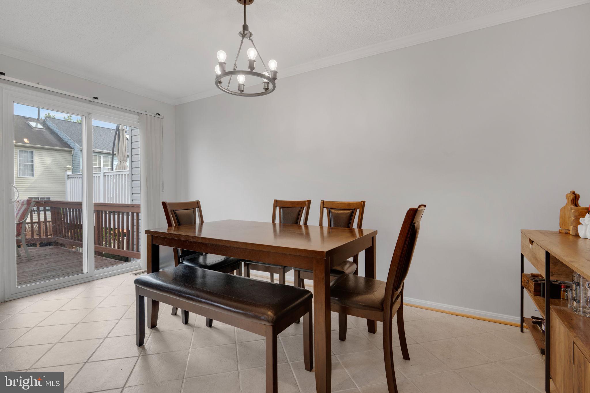 2348 Cold Meadow Way Silver Spring, MD 20906 - Photo 11 of 30 a view of a dining room with furniture and wooden floor