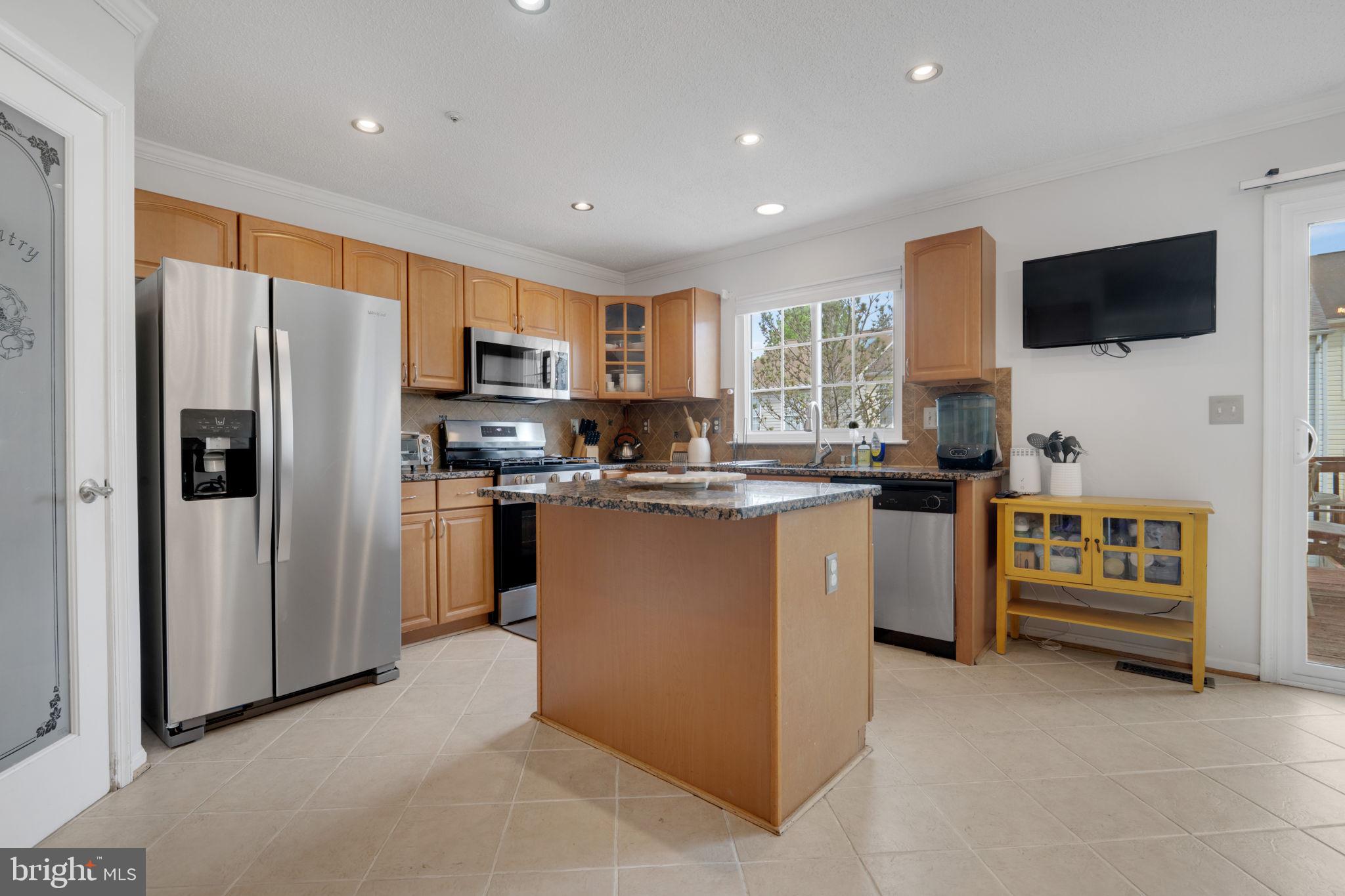 2348 Cold Meadow Way Silver Spring, MD 20906 - Photo 12 of 30 a kitchen with a refrigerator stove and microwave