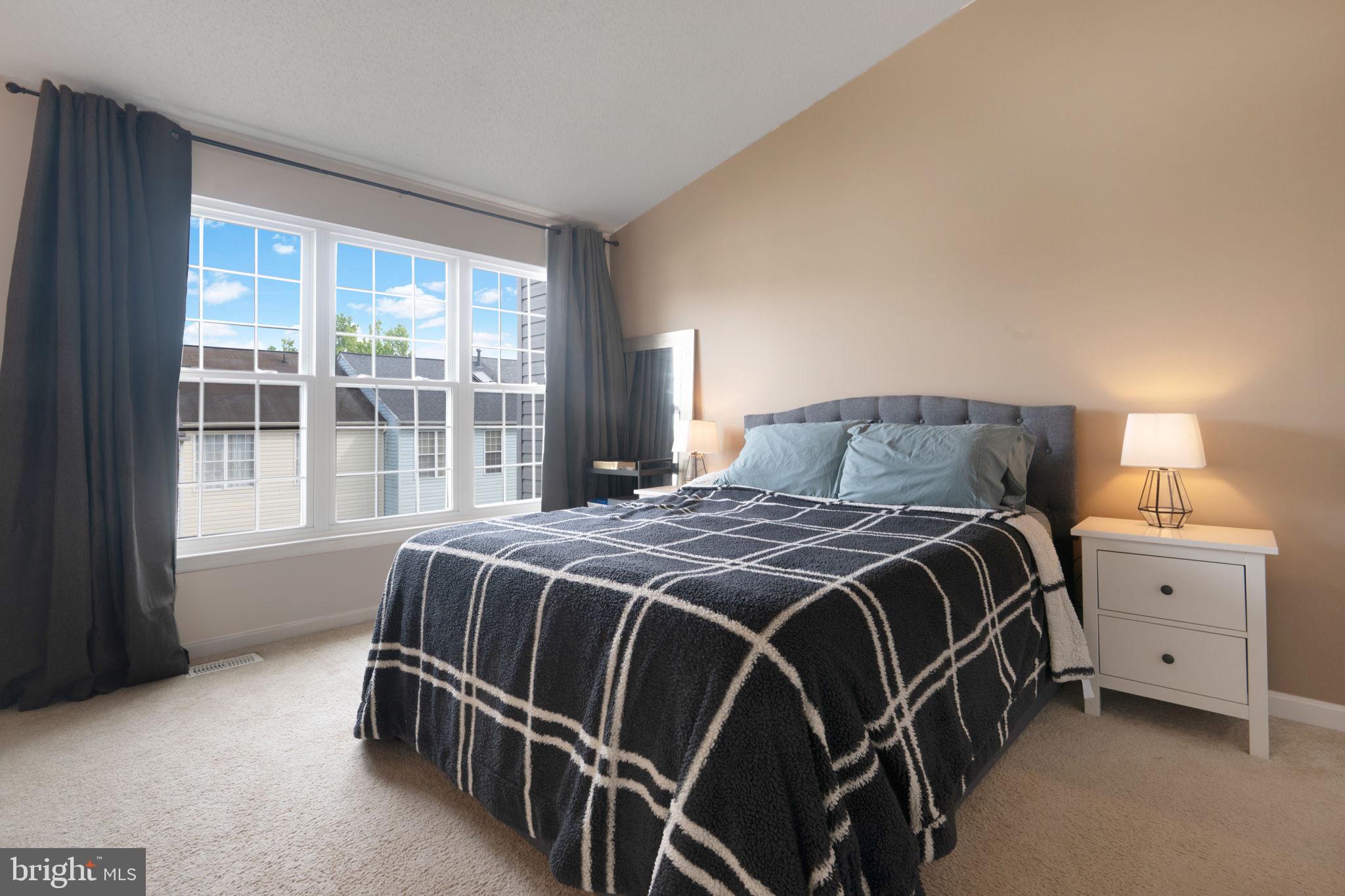 2348 Cold Meadow Way Silver Spring, MD 20906 - Photo 14 of 30 a bedroom with a bed and a window