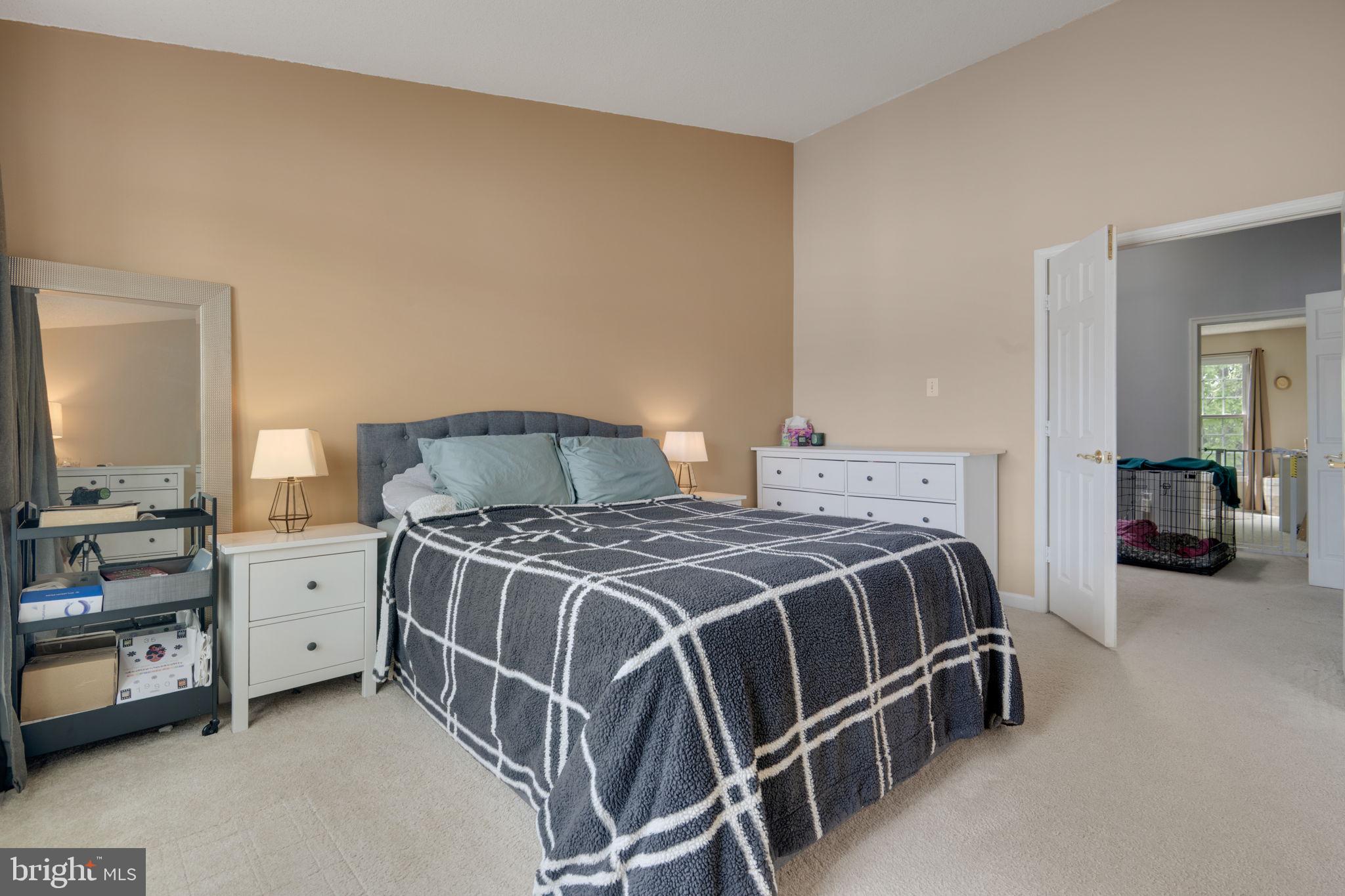 2348 Cold Meadow Way Silver Spring, MD 20906 - Photo 15 of 30 a bedroom with a bed and dresser