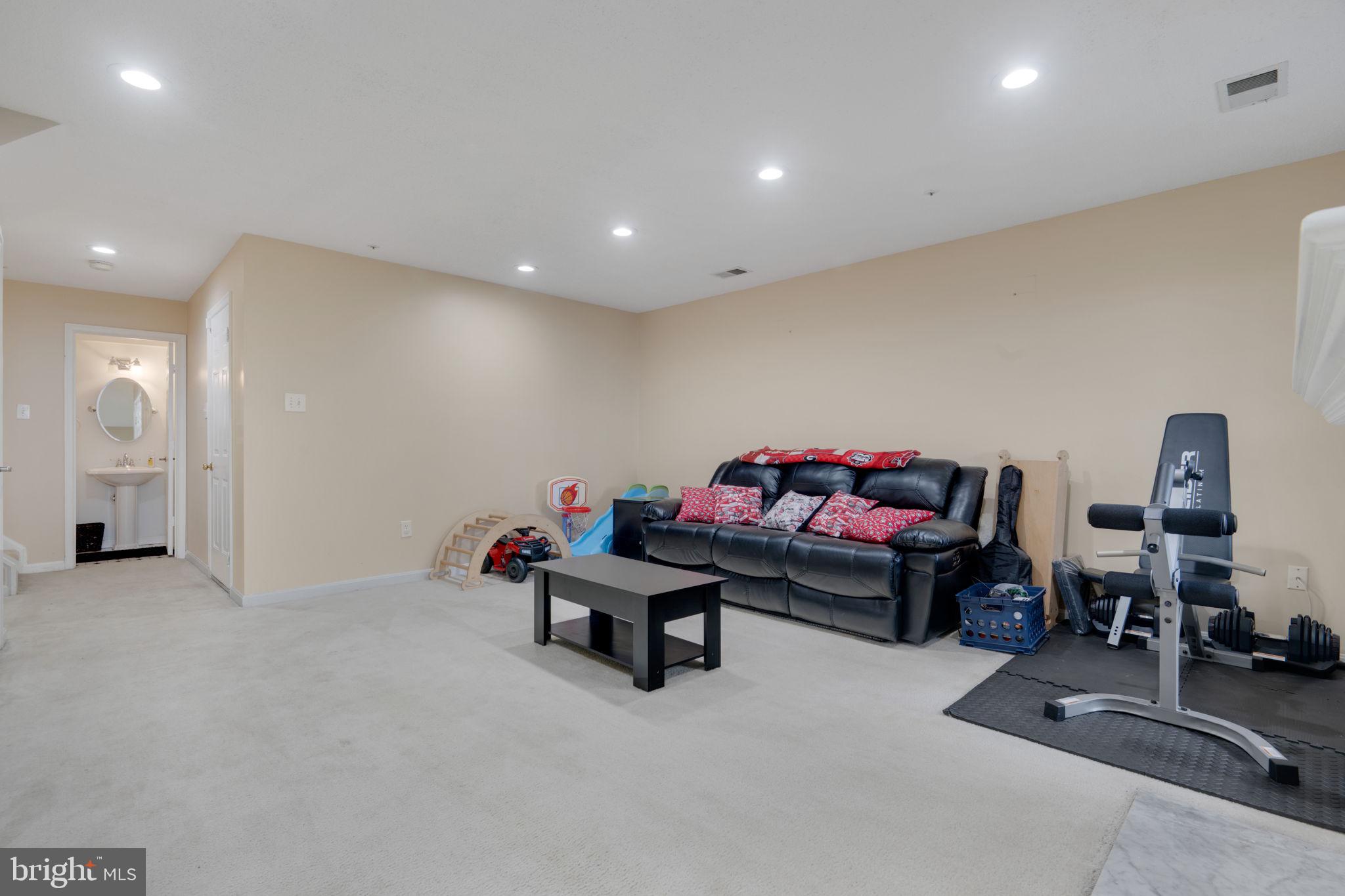 2348 Cold Meadow Way Silver Spring, MD 20906 - Photo 25 of 30 a living room with furniture and a couch