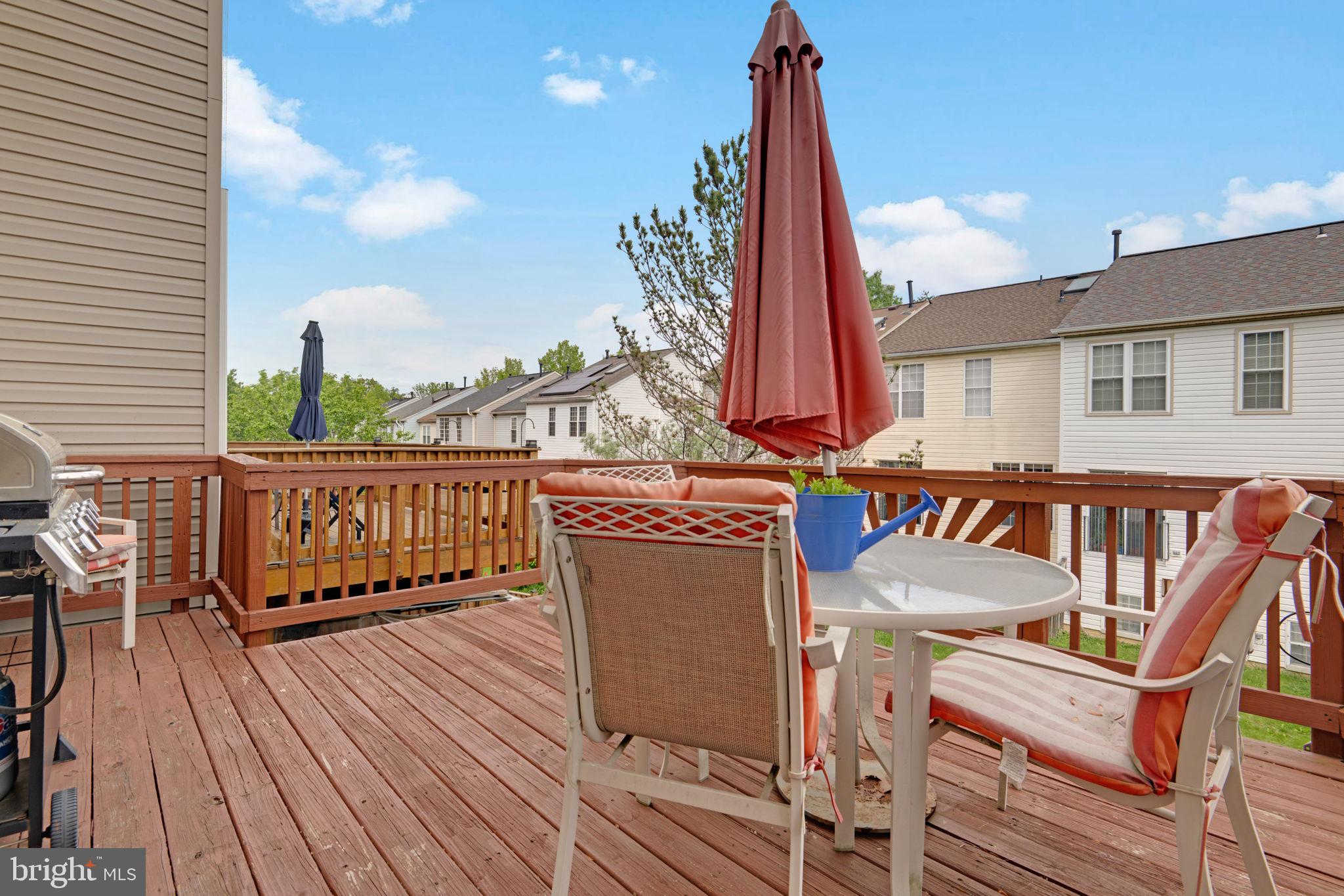 2348 Cold Meadow Way Silver Spring, MD 20906 - Photo 27 of 30 a view of a chairs and table on the wooden deck
