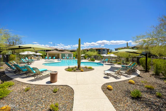 a view of swimming pool with outdoor seating