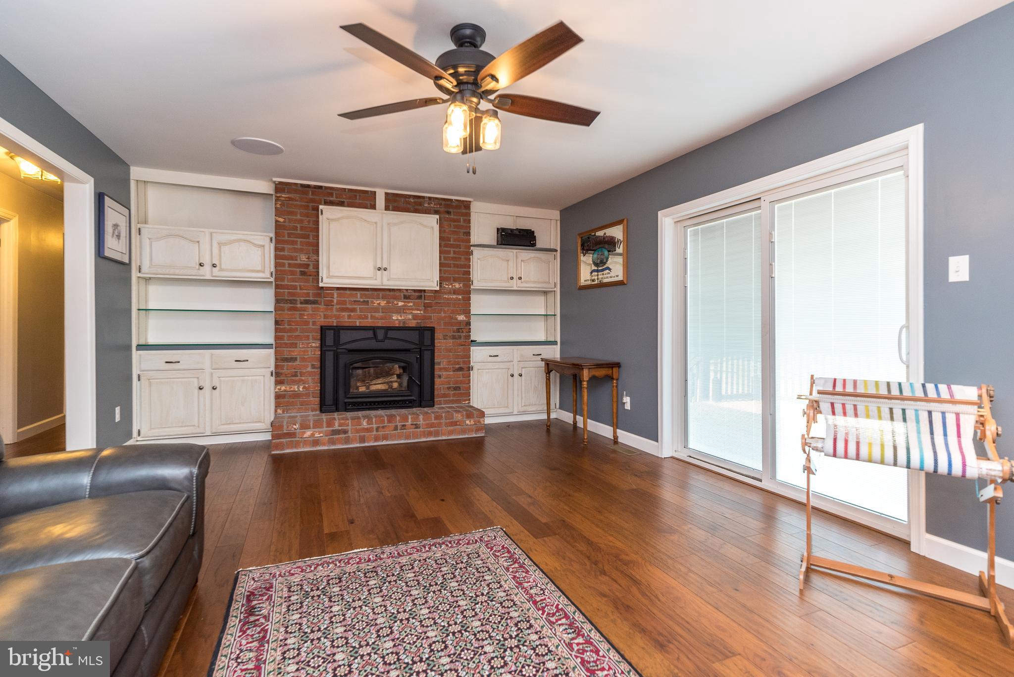 516 Upper Stump Road Chalfont, PA 18914 - Photo 8 of 37 Living room with fireplace & built- ins