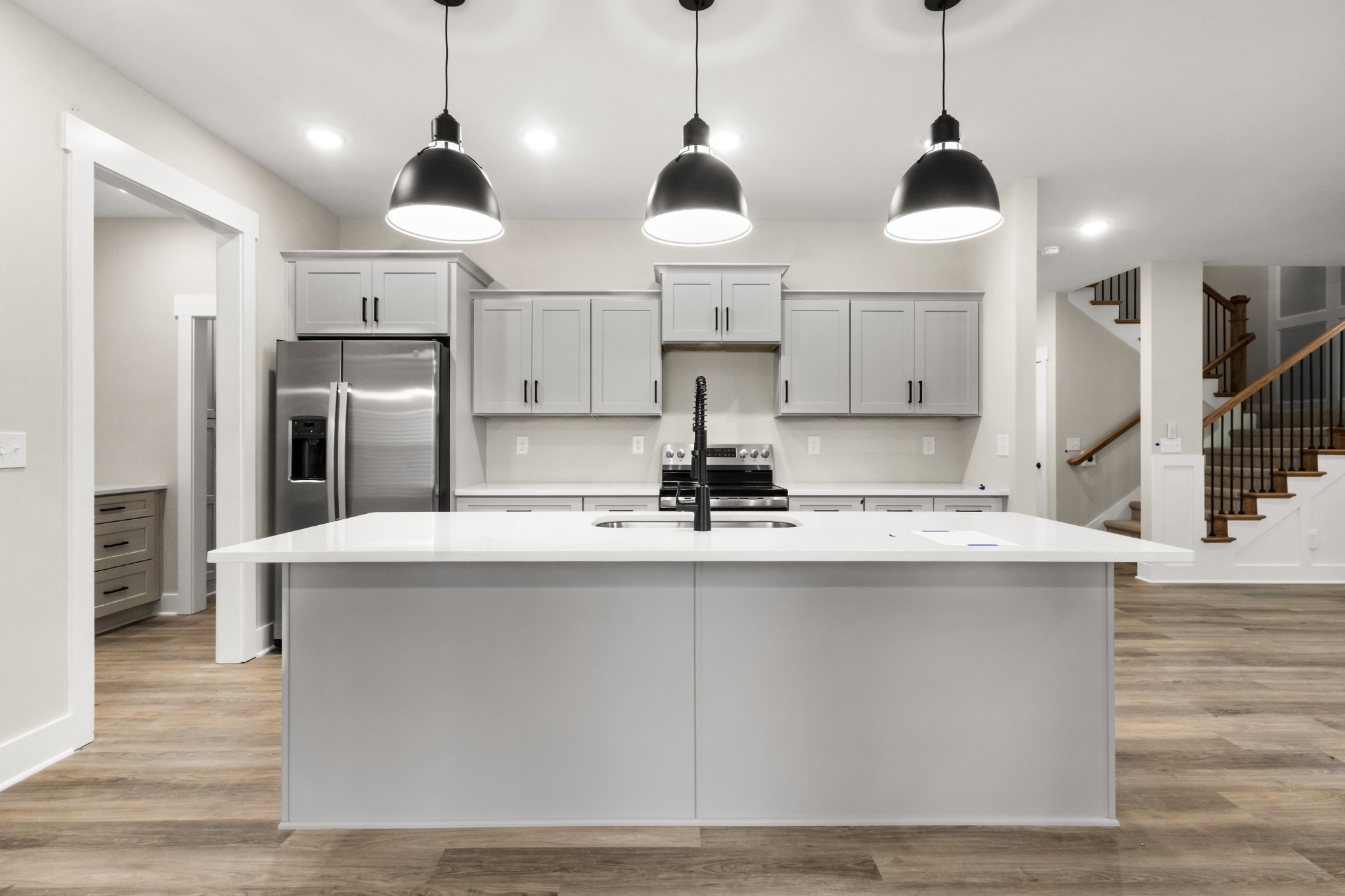 1105 Black Rock Road Clarksville, TN 37040 - Photo 34 of 45 a kitchen with stainless steel appliances granite countertop a sink a stove and a refrigerator