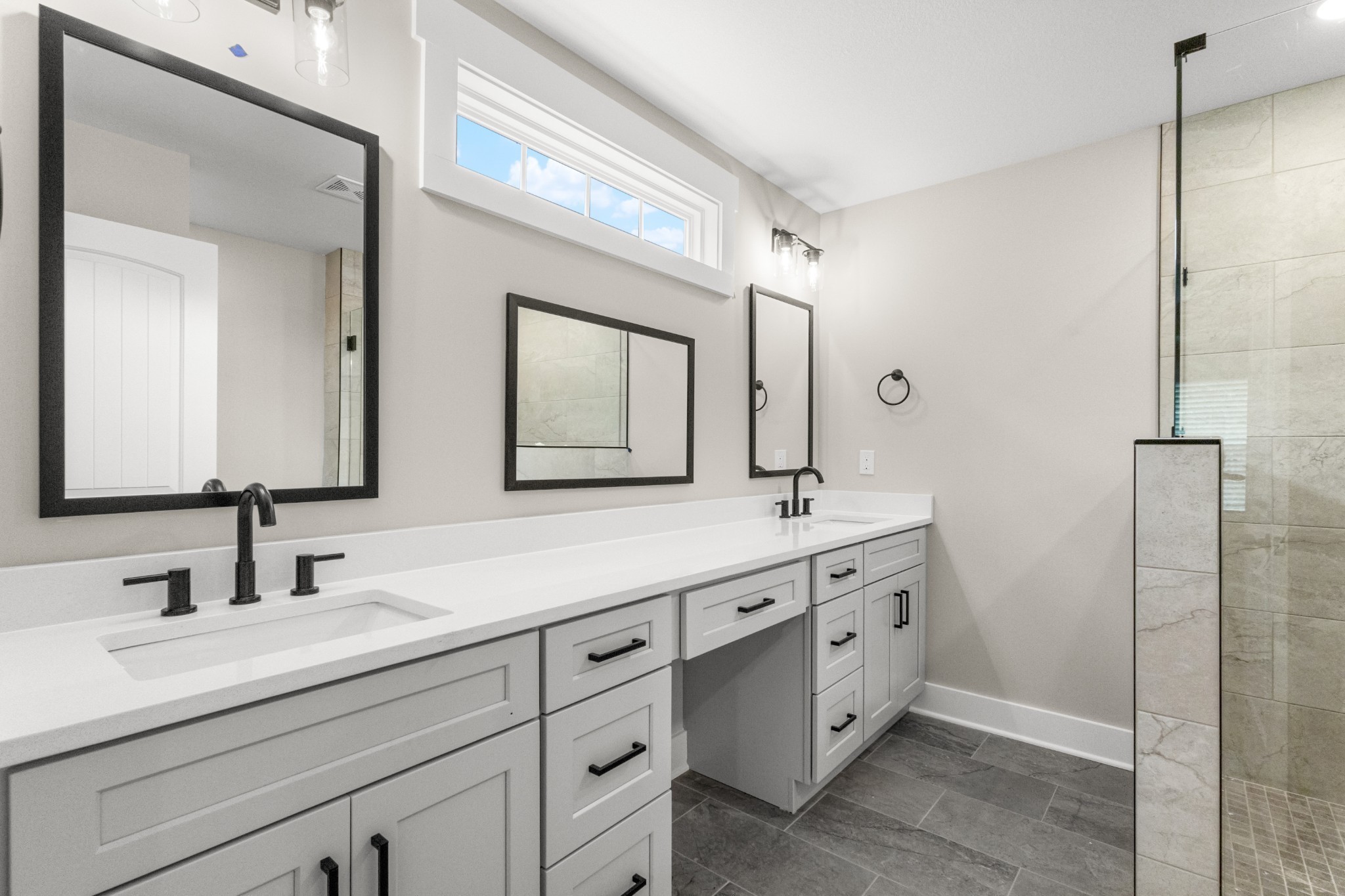 1105 Black Rock Road Clarksville, TN 37040 - Photo 37 of 45 a bathroom with a double vanity sink and mirror