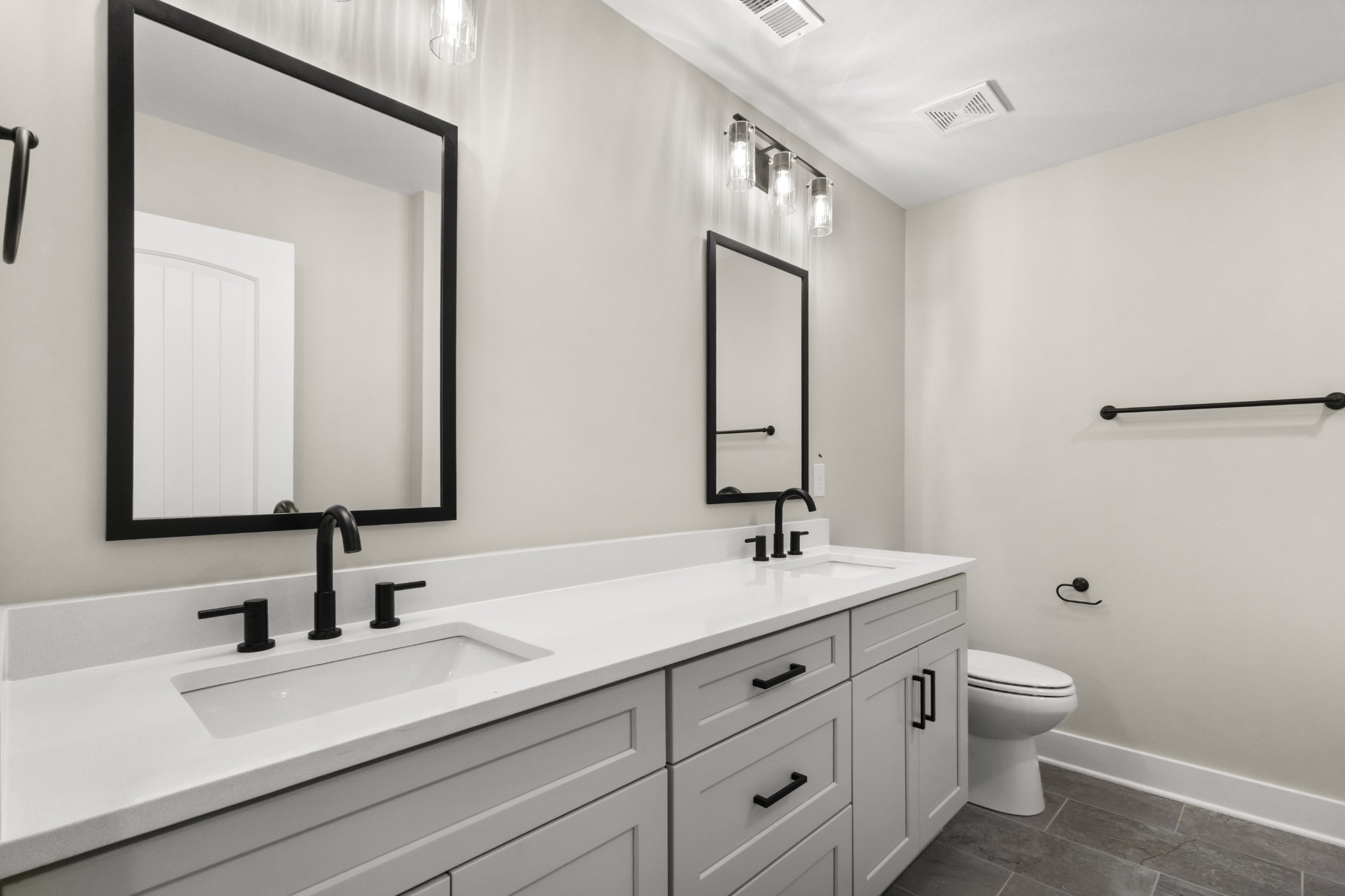 1105 Black Rock Road Clarksville, TN 37040 - Photo 44 of 45 a bathroom with a sink a toilet and a mirror