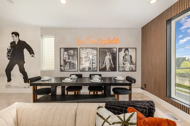 a view of a workspace with furniture and window