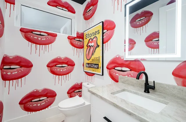 a bathroom with a bath tub and sink