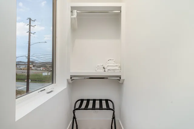 a bathroom with a shower and a sink