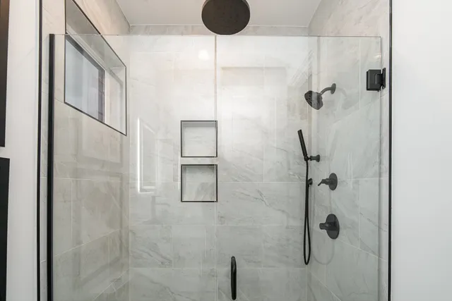 a large white bed in a white room