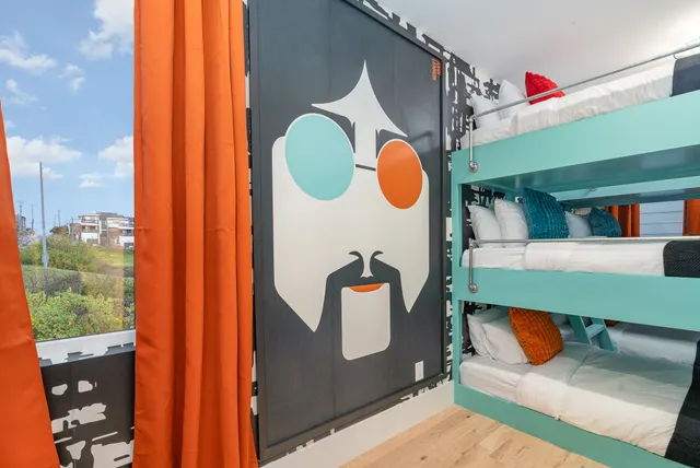 a bedroom with a bed and a mirror