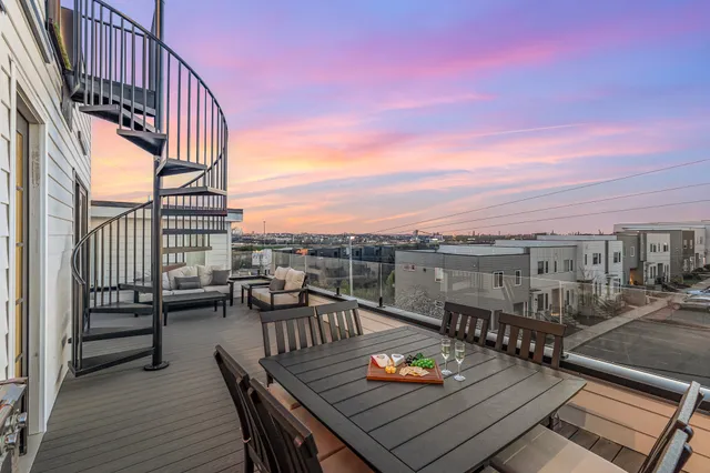 a view of roof deck with patio