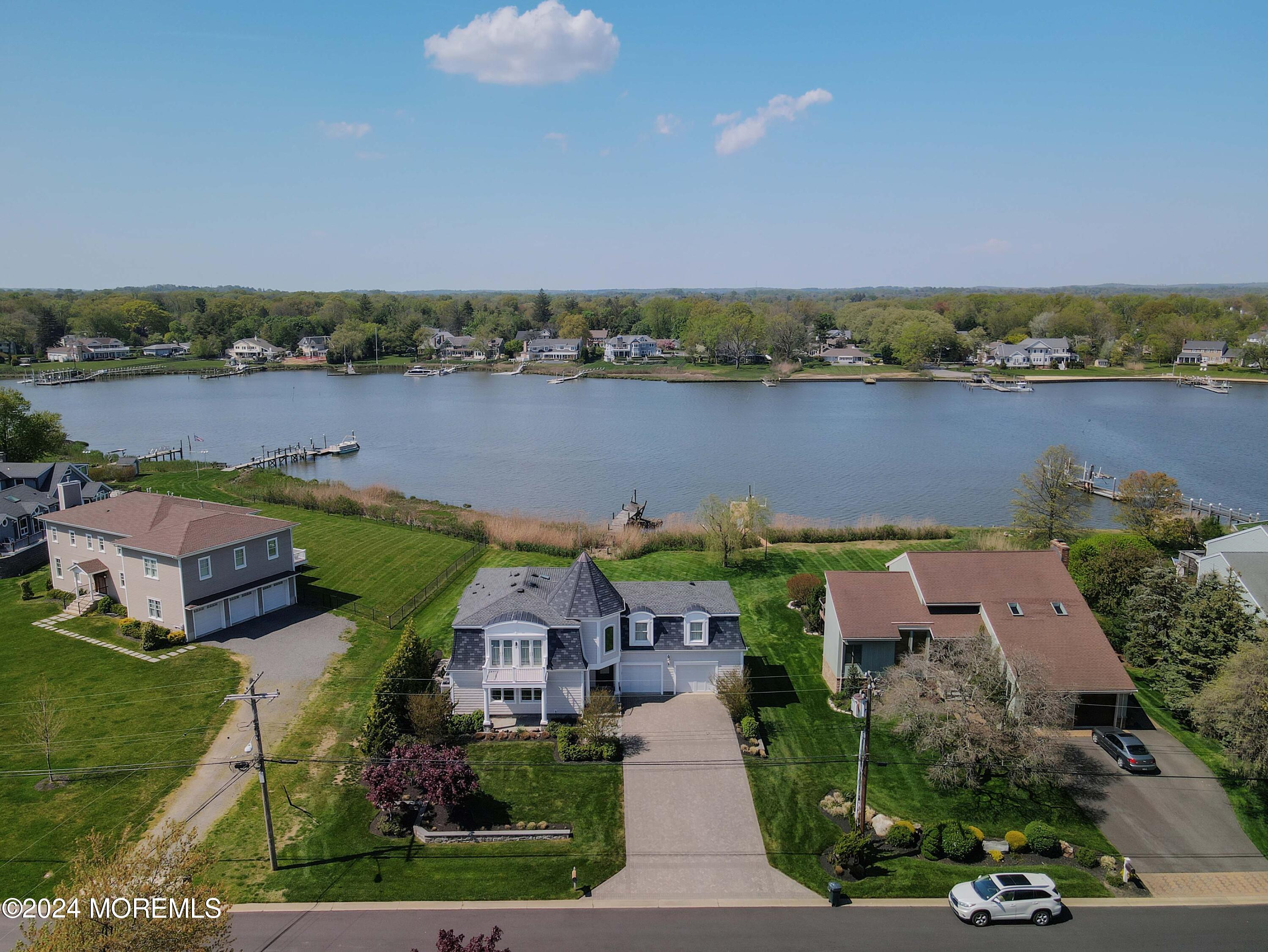 an aerial view of a house with a lake view and a lake view