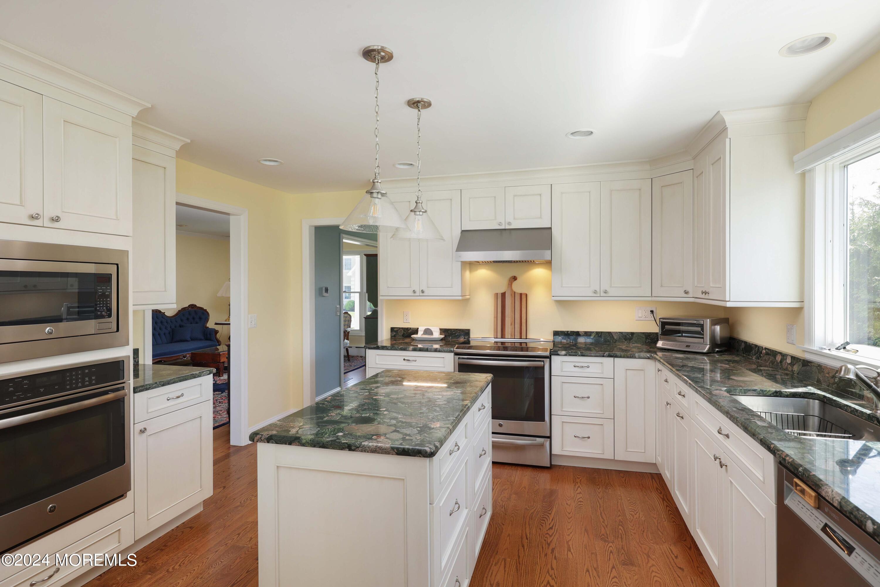 121 Horseneck Road Oceanport, NJ 07757 - Photo 13 of 48 a kitchen with a stove sink and refrigerator