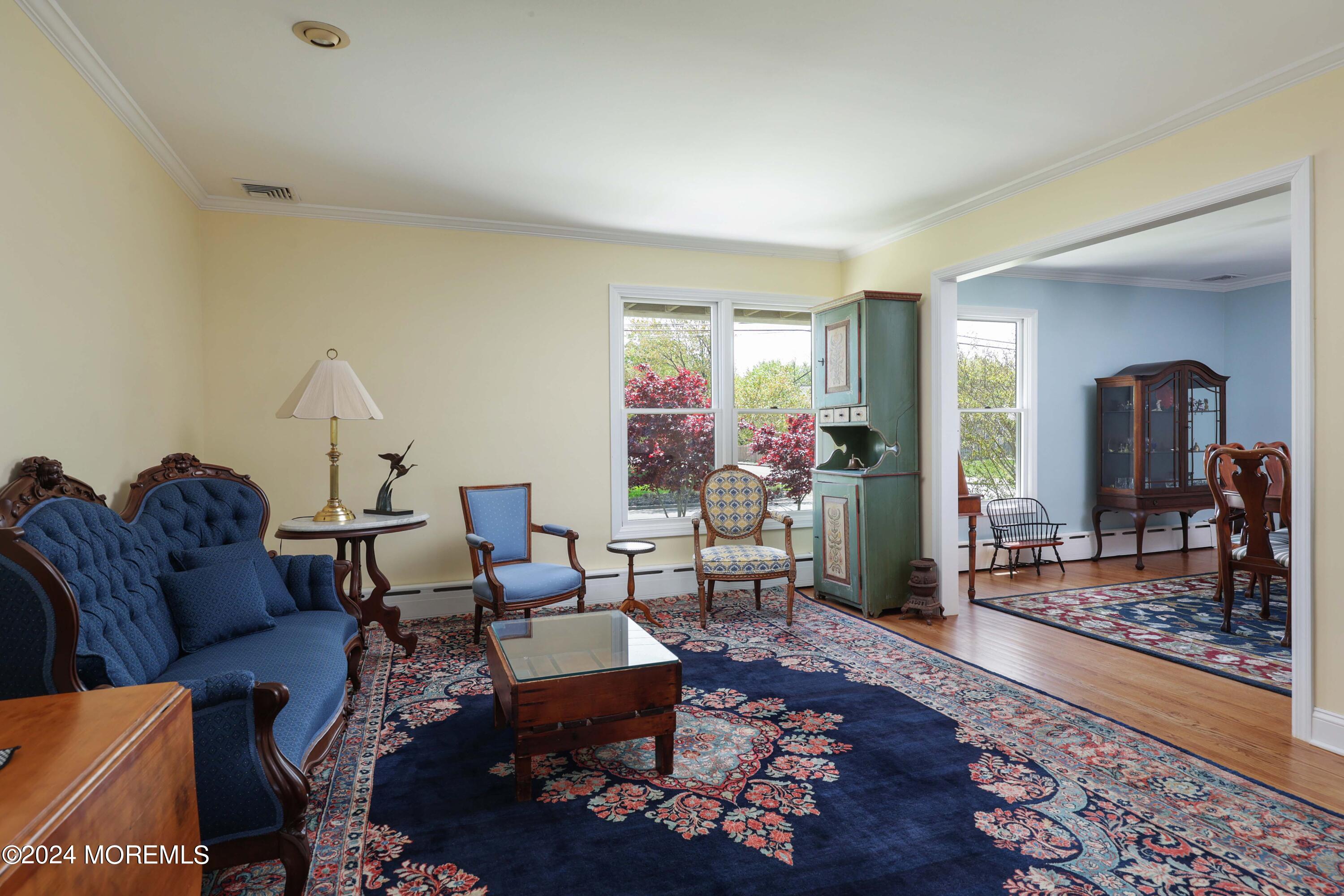 121 Horseneck Road Oceanport, NJ 07757 - Photo 14 of 48 a living room with furniture and a rug