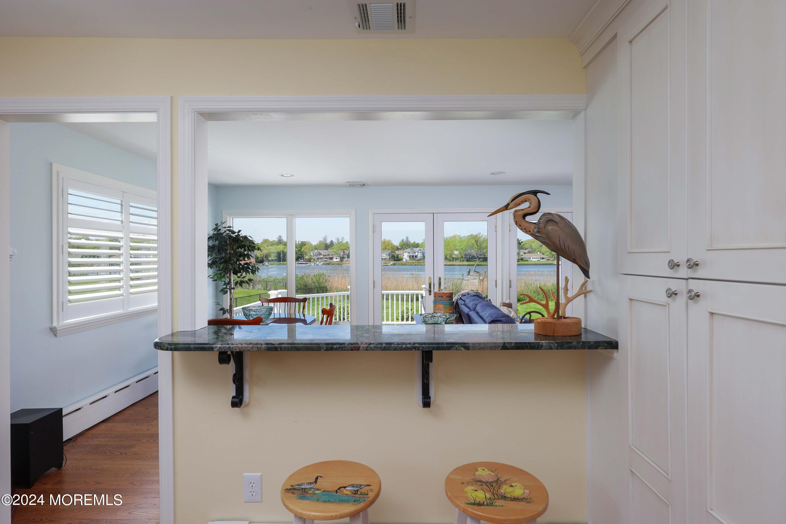 121 Horseneck Road Oceanport, NJ 07757 - Photo 15 of 48 a room with a table and a large window