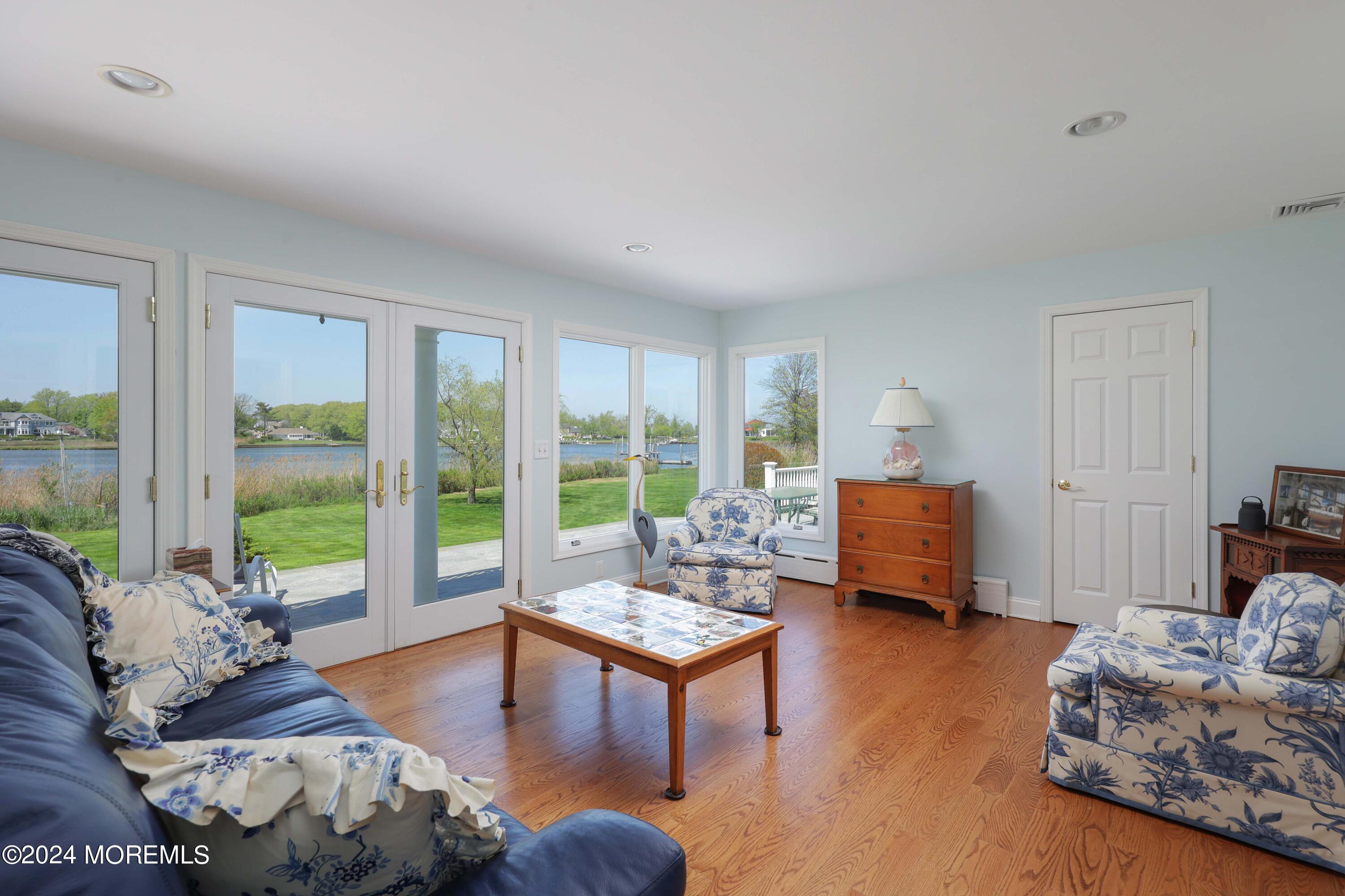 121 Horseneck Road Oceanport, NJ 07757 - Photo 17 of 48 a living room with furniture and floor to ceiling window