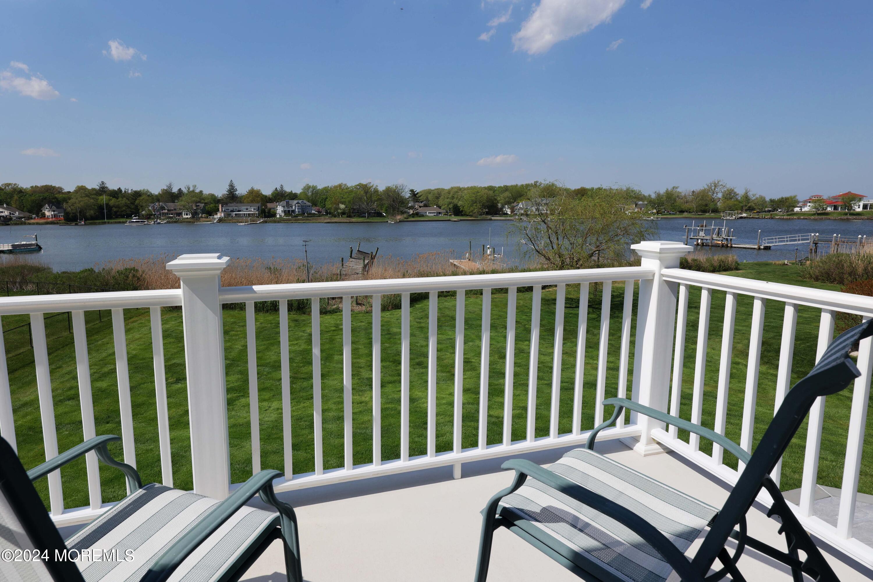 121 Horseneck Road Oceanport, NJ 07757 - Photo 19 of 48 a view of a balcony with wooden chairs and floor to city view