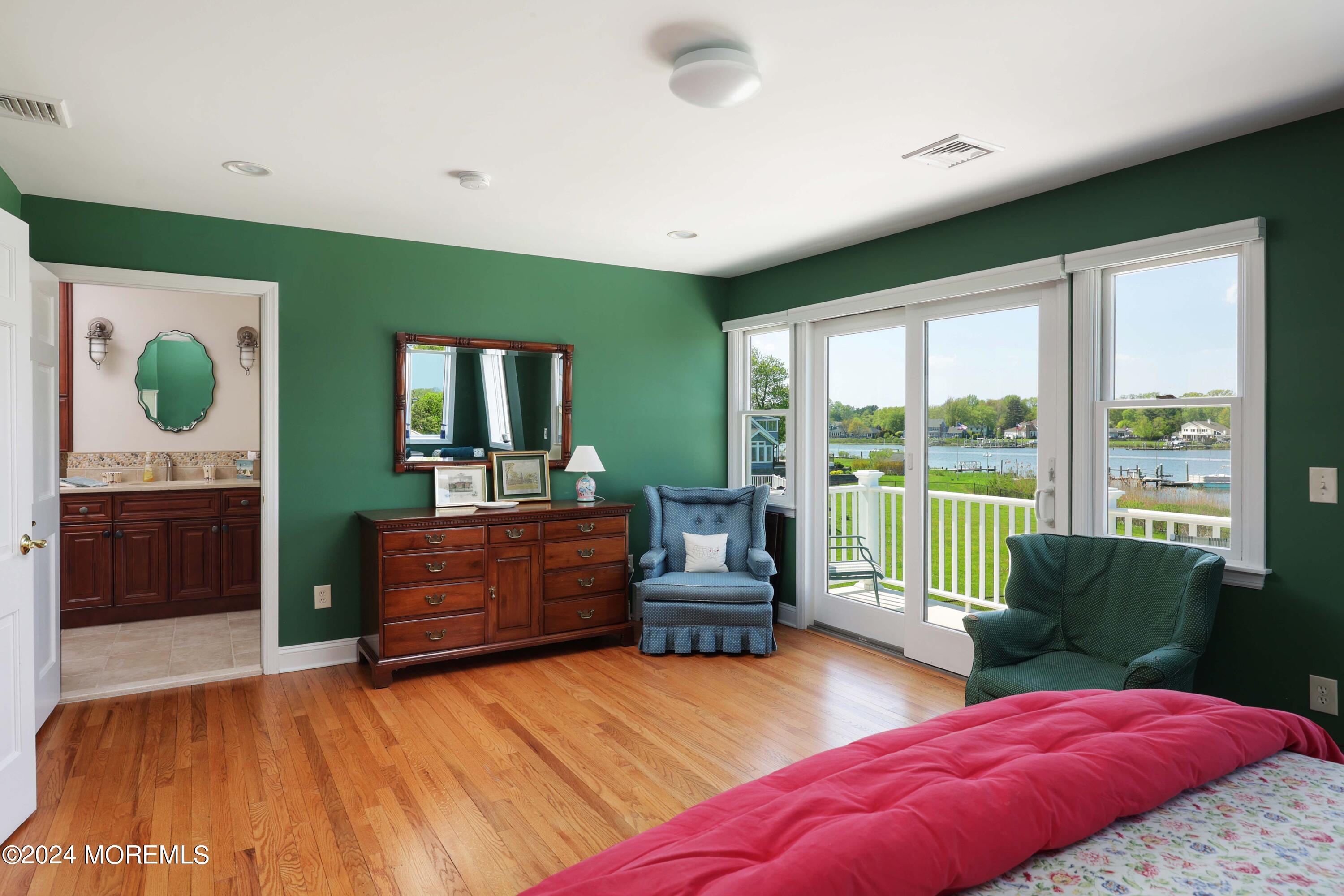 121 Horseneck Road Oceanport, NJ 07757 - Photo 22 of 48 a bedroom with a bed and a large window