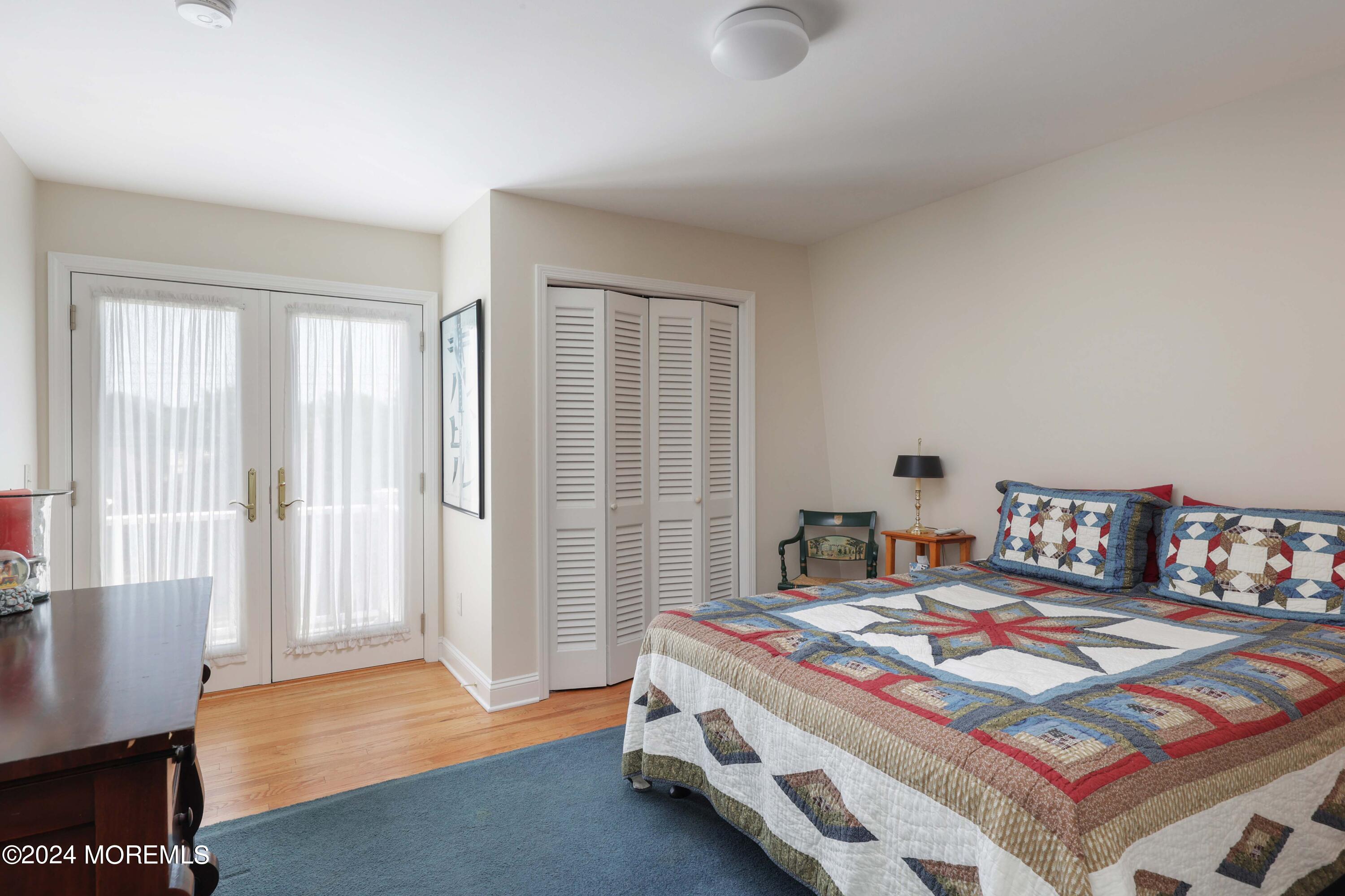121 Horseneck Road Oceanport, NJ 07757 - Photo 23 of 48 a bedroom with a bed and a window