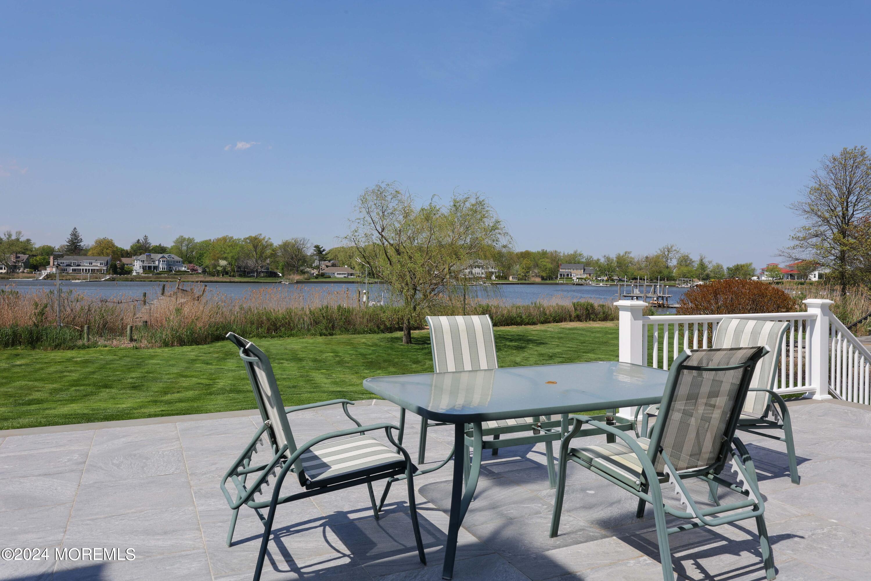 121 Horseneck Road Oceanport, NJ 07757 - Photo 26 of 48 a view of a chairs and table on the terrace