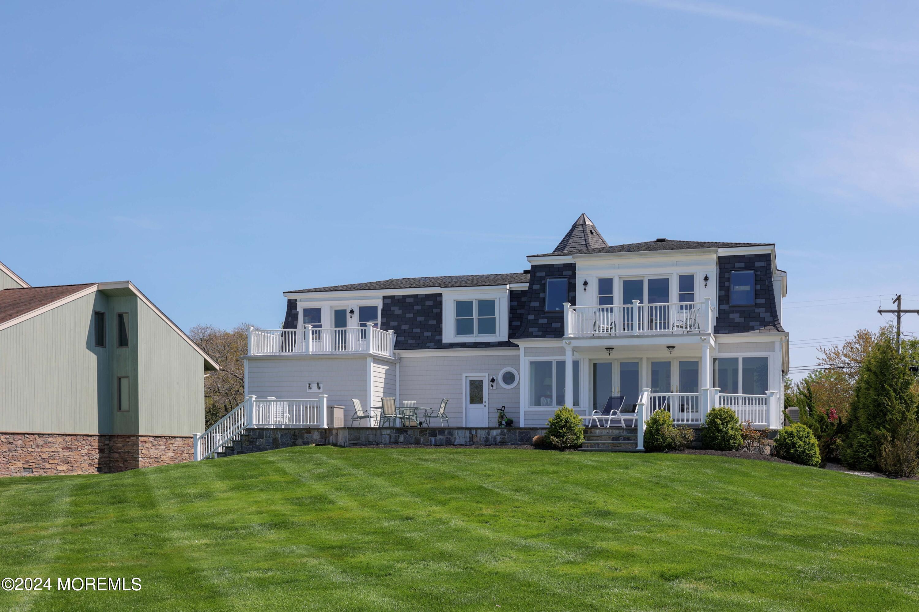121 Horseneck Road Oceanport, NJ 07757 - Photo 27 of 48 a front view of a house with a garden