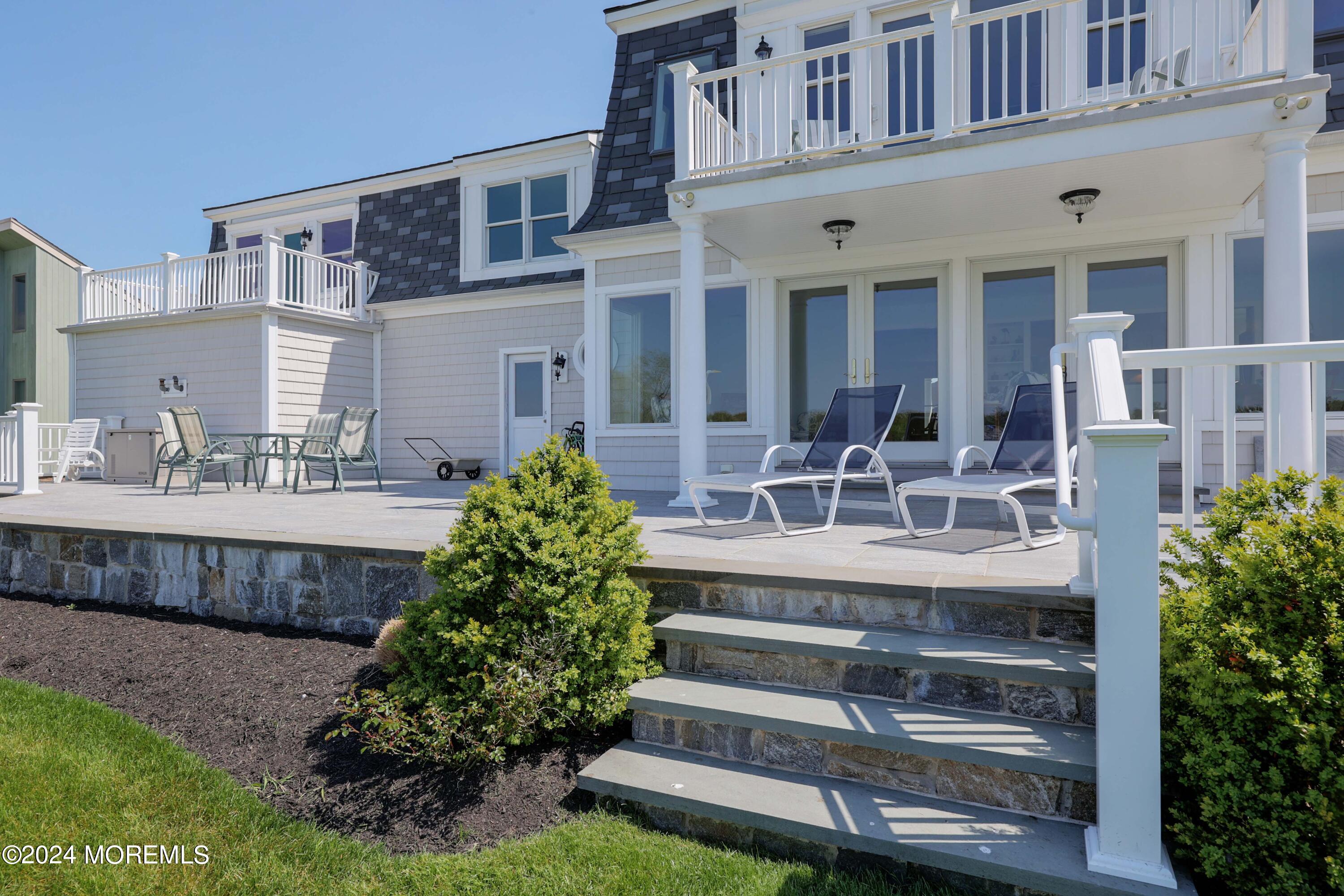 121 Horseneck Road Oceanport, NJ 07757 - Photo 29 of 48 a view of a house with a patio