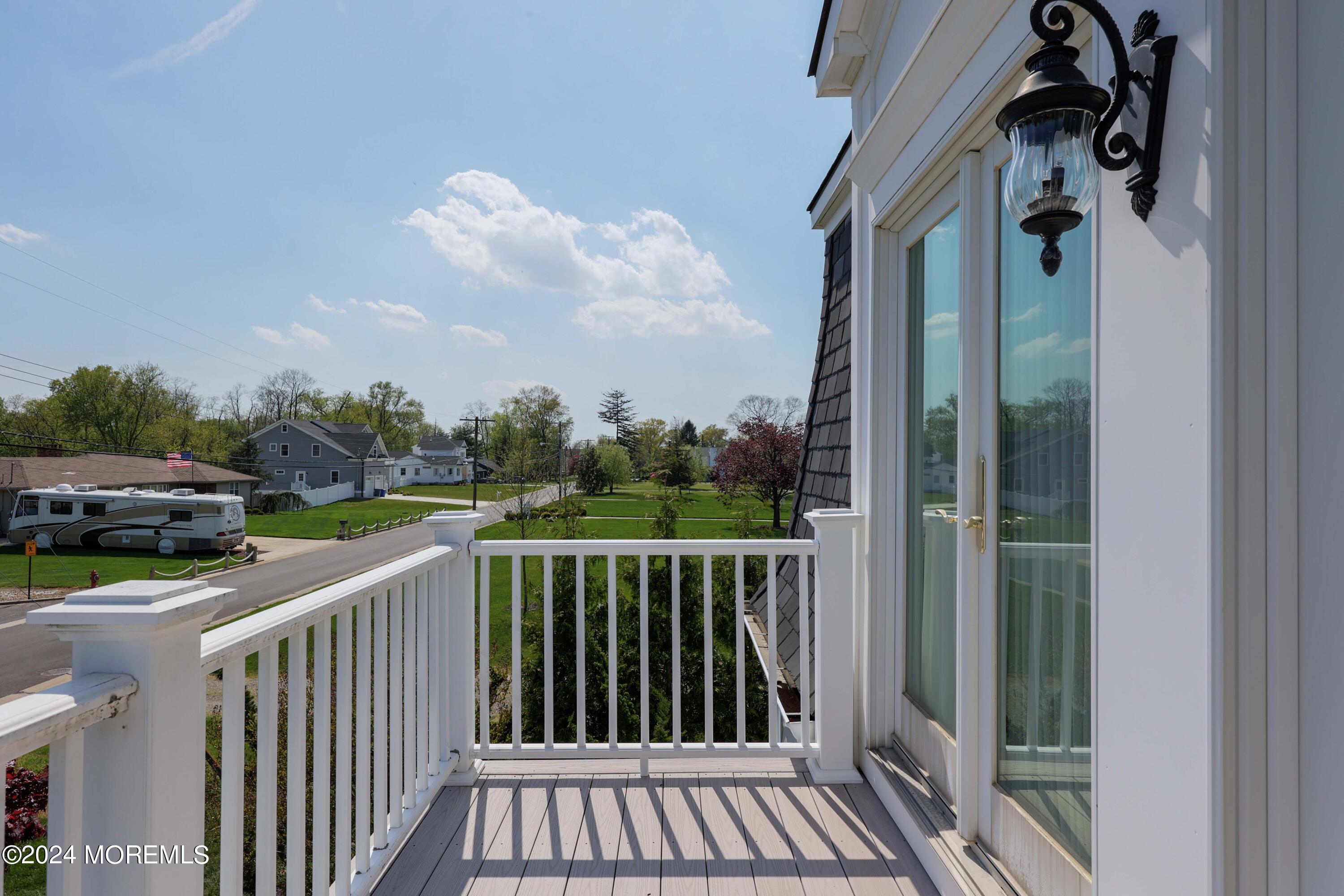 121 Horseneck Road Oceanport, NJ 07757 - Photo 33 of 48 a view of a balcony with car parked