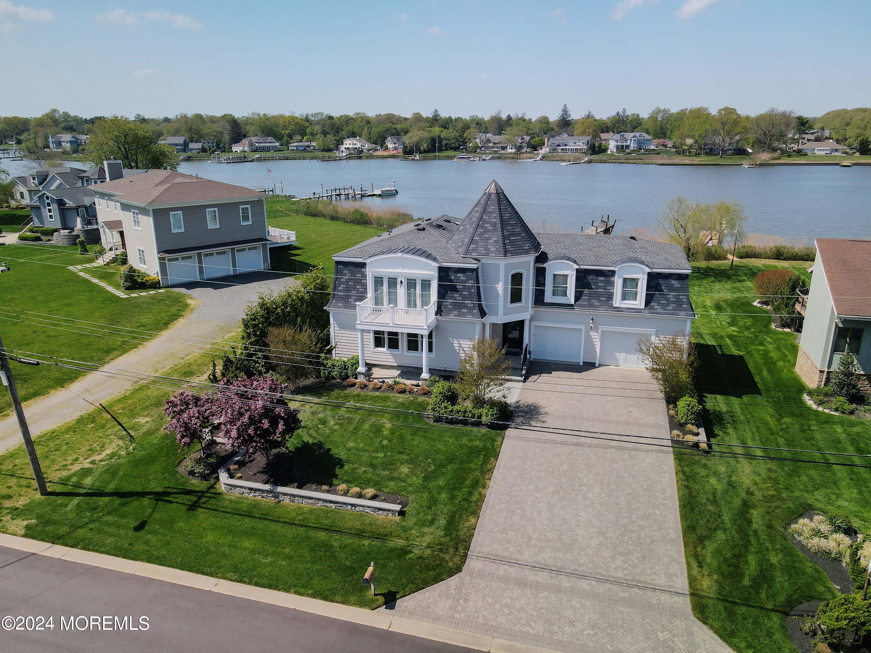 121 Horseneck Road Oceanport, NJ 07757 - Photo 36 of 48 a front view of a house with a garden and lake view