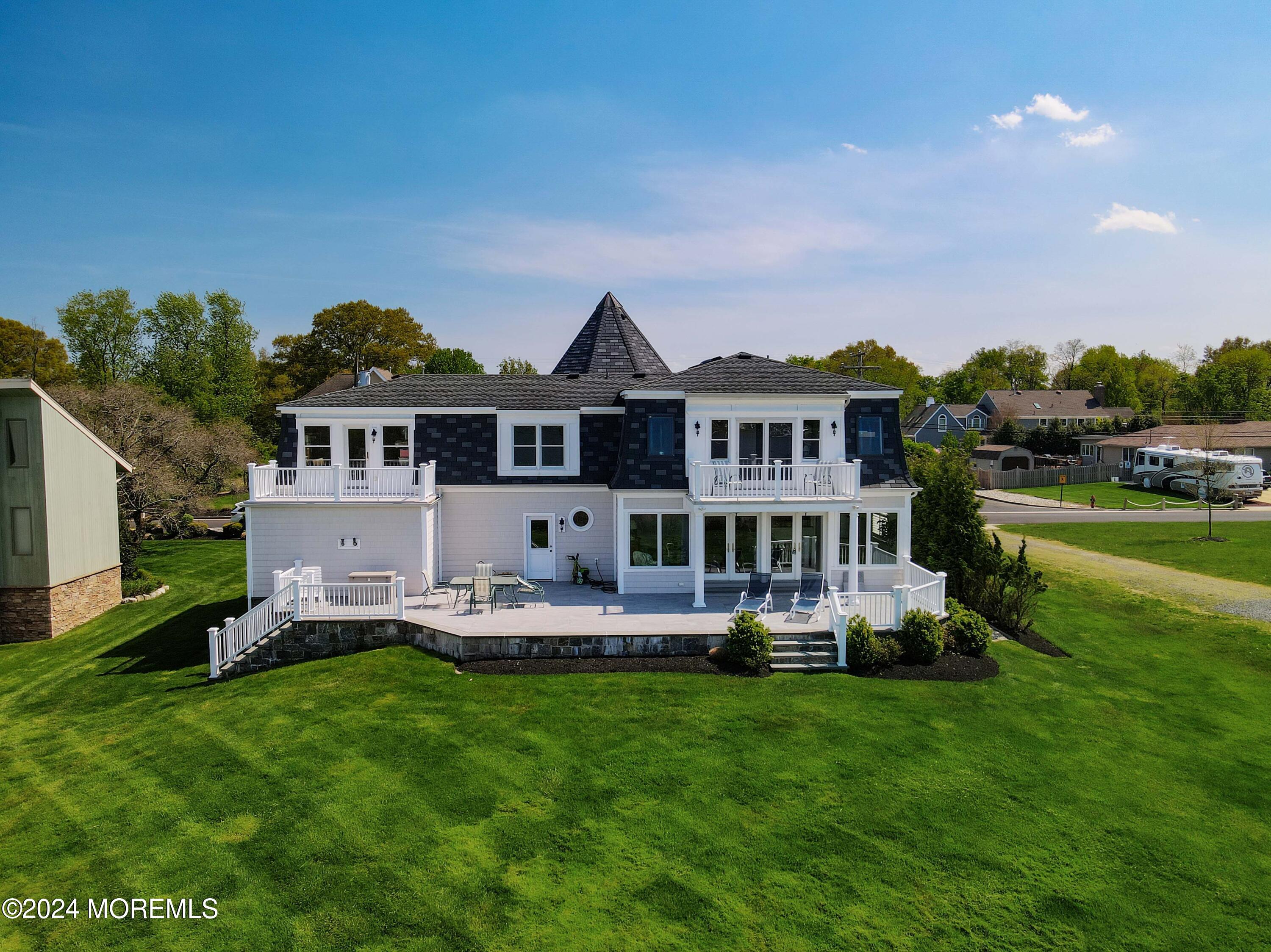 121 Horseneck Road Oceanport, NJ 07757 - Photo 42 of 48 a front view of a house with garden and houses