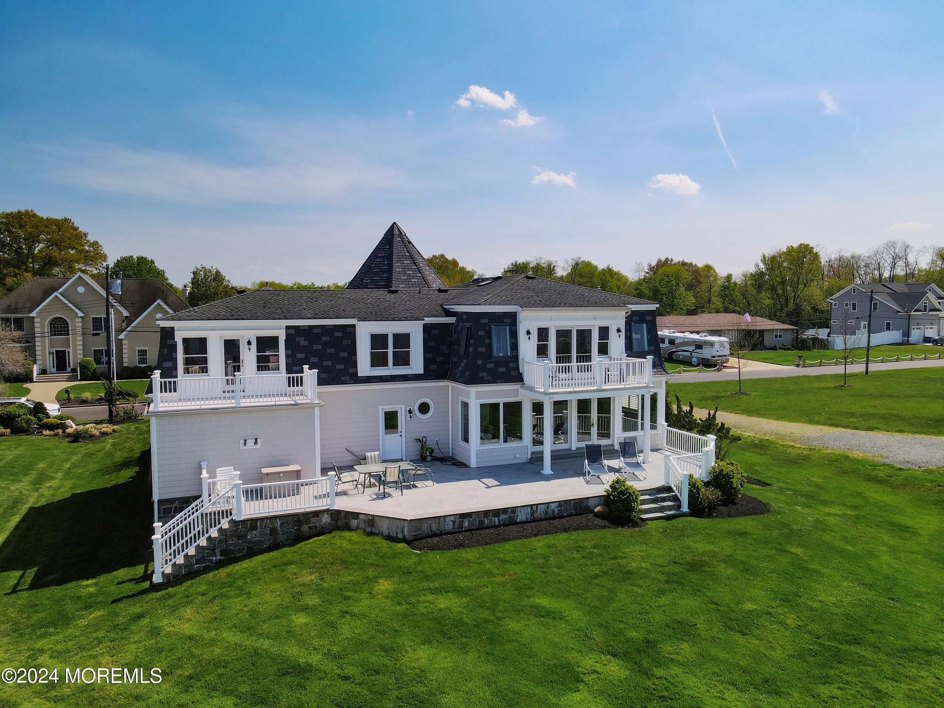 121 Horseneck Road Oceanport, NJ 07757 - Photo 43 of 48 a front view of a house with a garden and trees