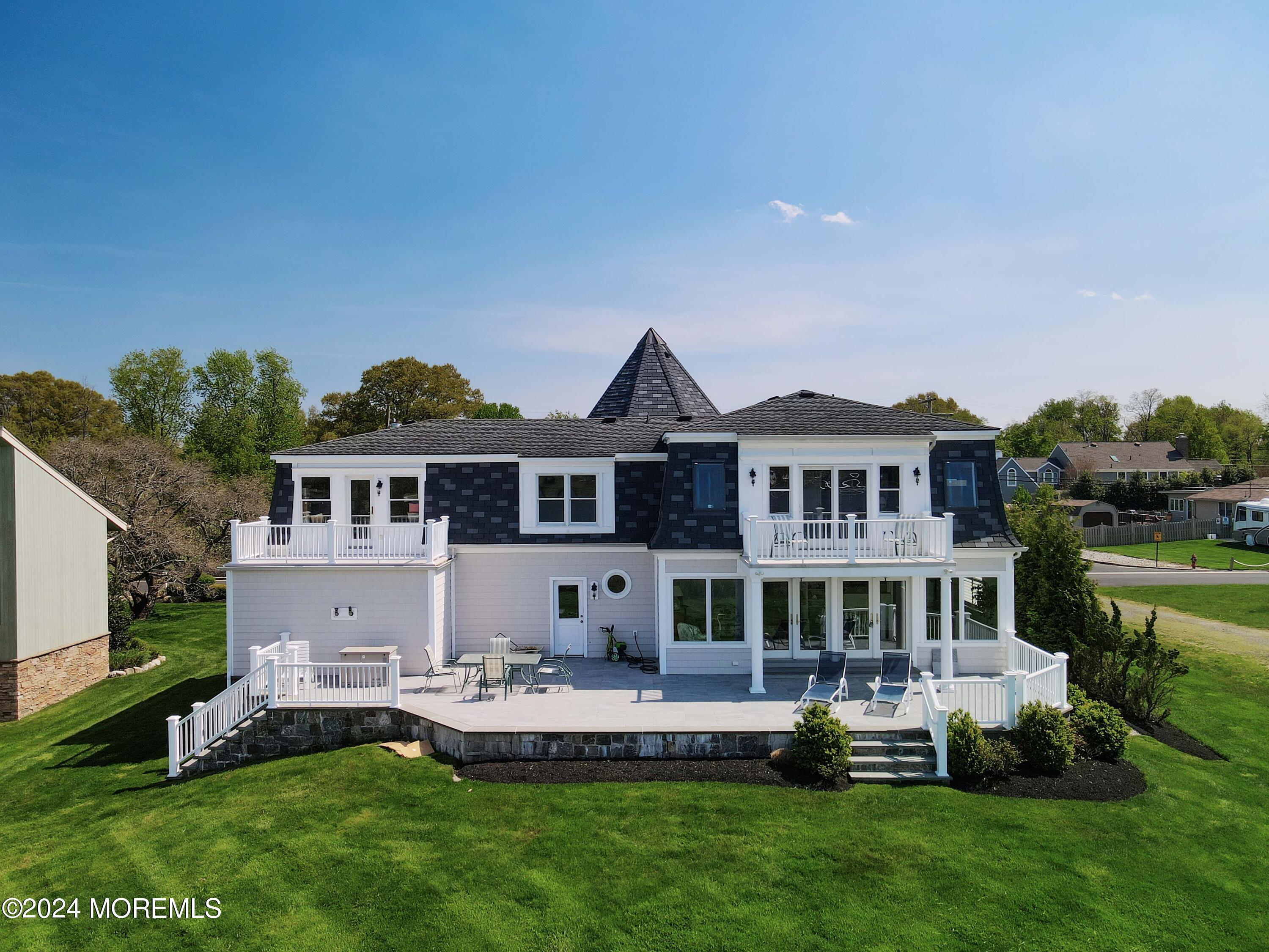 121 Horseneck Road Oceanport, NJ 07757 - Photo 48 of 48 a front view of a house with a yard table and chairs