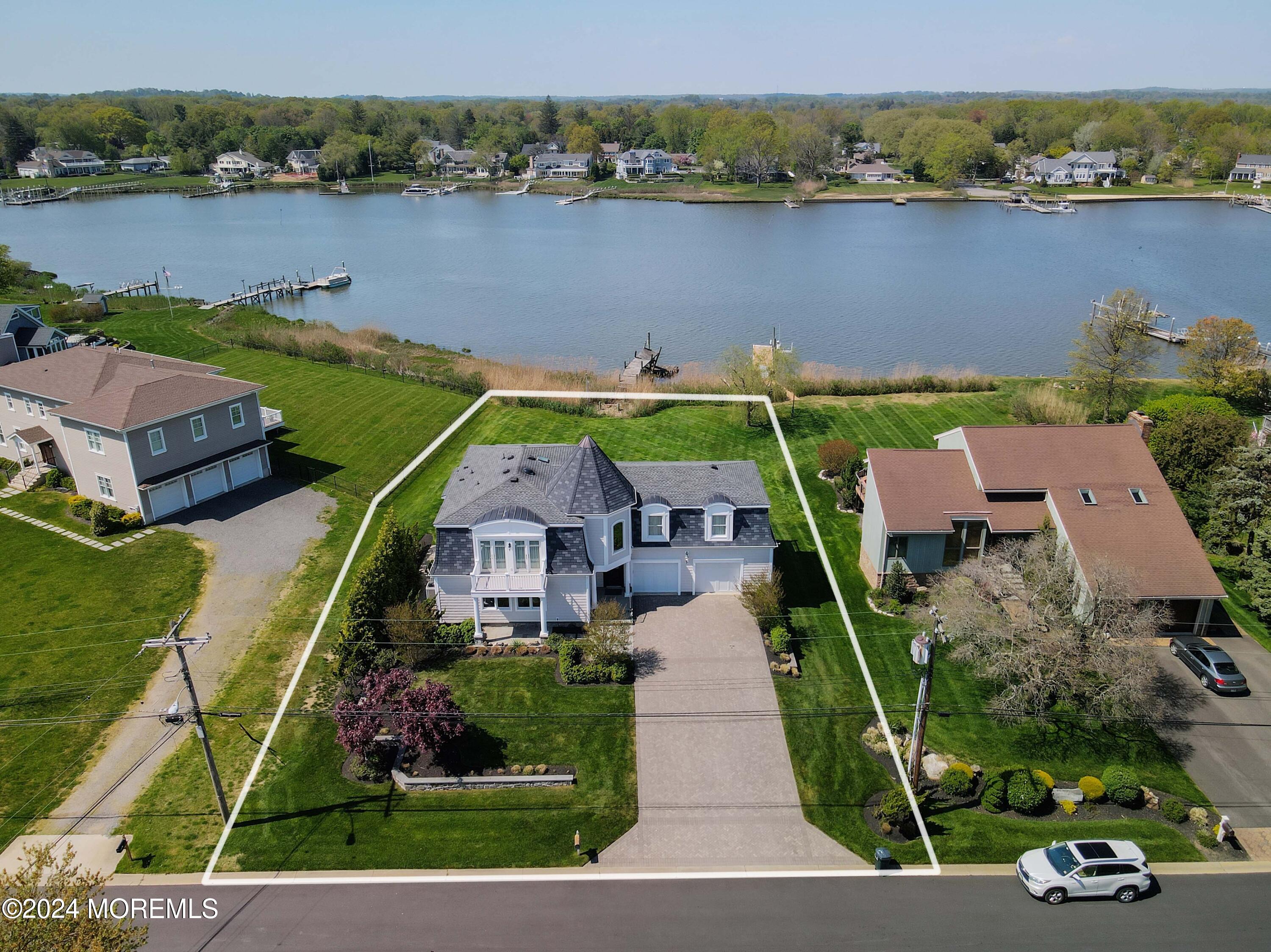 121 Horseneck Road Oceanport, NJ 07757 - Photo 5 of 48 an aerial view of a house with a garden and lake view