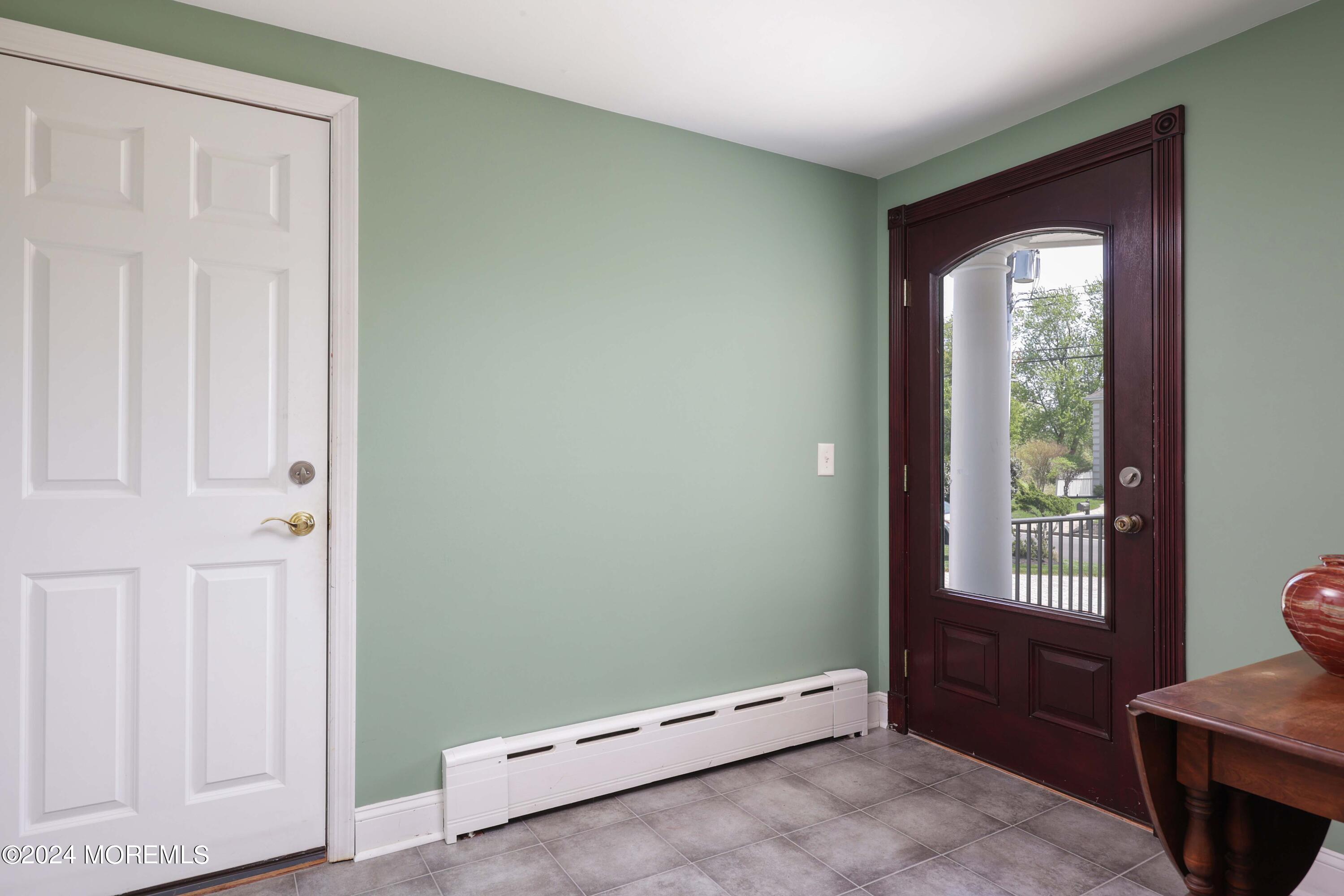 121 Horseneck Road Oceanport, NJ 07757 - Photo 6 of 48 a view of an empty room with a window