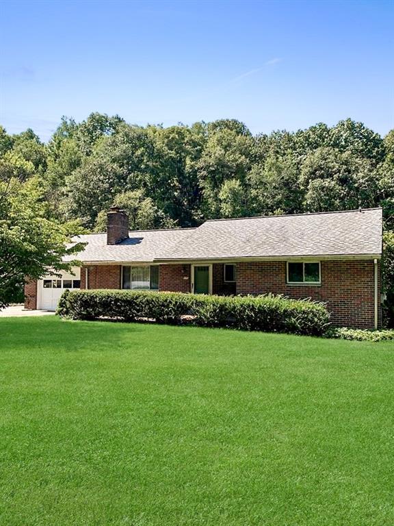 170 Crisswell Road Butler, PA 16002 - Photo 1 of 18 a front view of a house with a garden