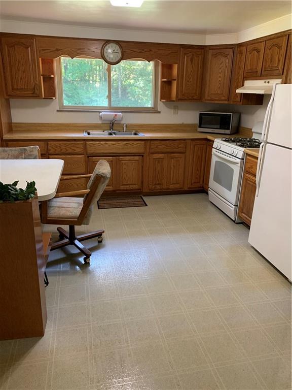 170 Crisswell Road Butler, PA 16002 - Photo 4 of 18 a kitchen with sink cabinets and window