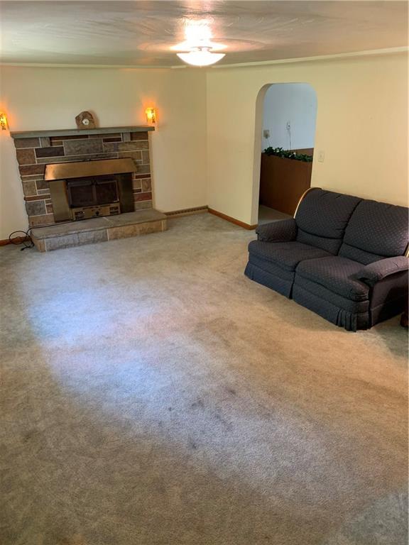 170 Crisswell Road Butler, PA 16002 - Photo 5 of 18 a living room with furniture and a fireplace