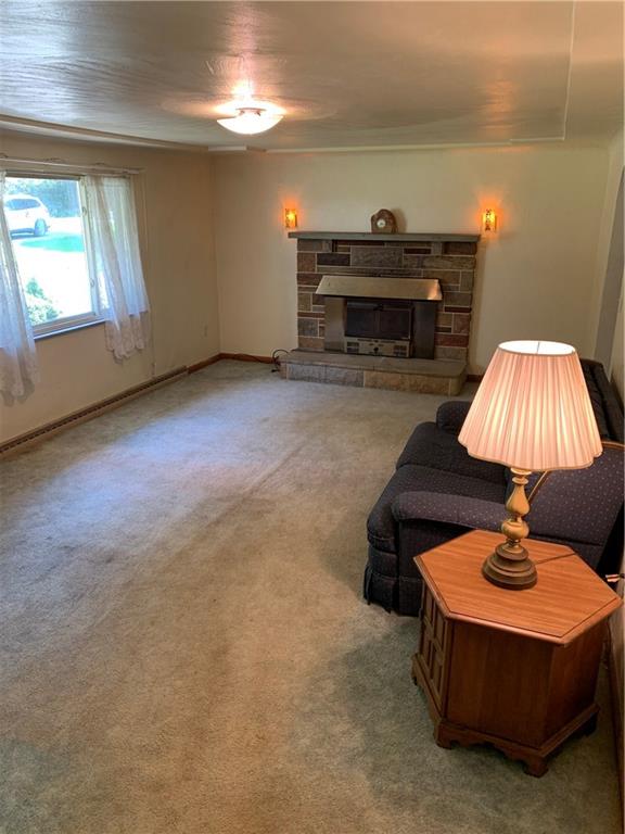 170 Crisswell Road Butler, PA 16002 - Photo 7 of 18 a living room with furniture and a fireplace
