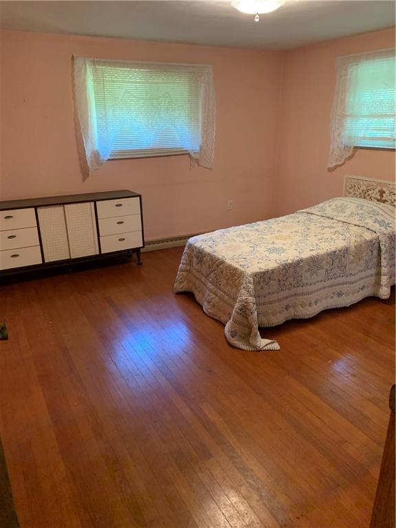 170 Crisswell Road Butler, PA 16002 - Photo 8 of 18 a bedroom with a bed and a night stand