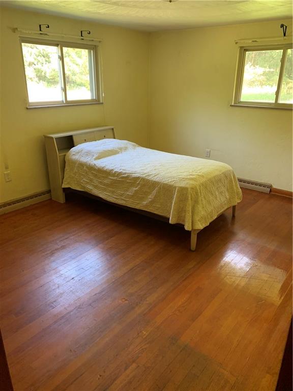 170 Crisswell Road Butler, PA 16002 - Photo 10 of 18 a bed sitting in a bedroom next to a window