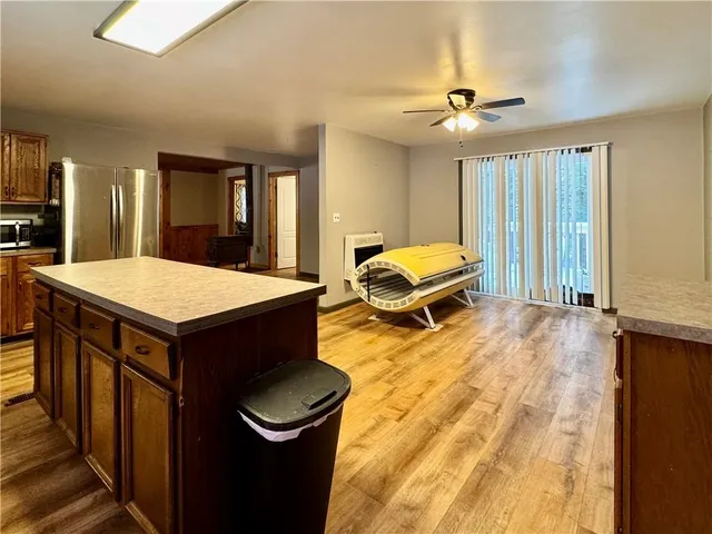 a kitchen with a stove sink and a refrigerator