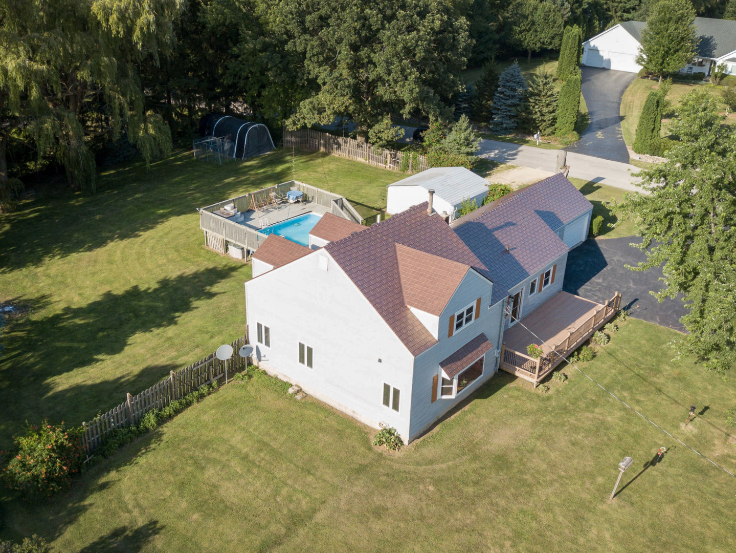 20806 Lembcke Road Harvard, IL 60033 - Photo 2 of 44 an aerial view of a house with swimming pool and a yard