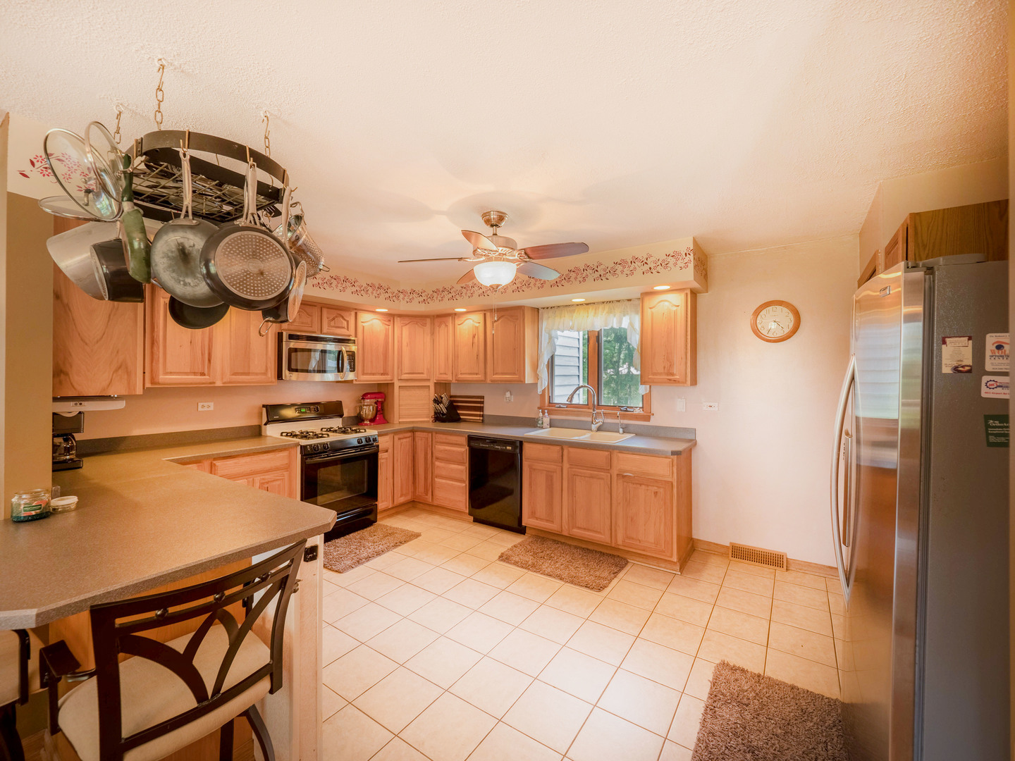 20806 Lembcke Road Harvard, IL 60033 - Photo 11 of 44 a kitchen with a sink cabinets and stainless steel appliances