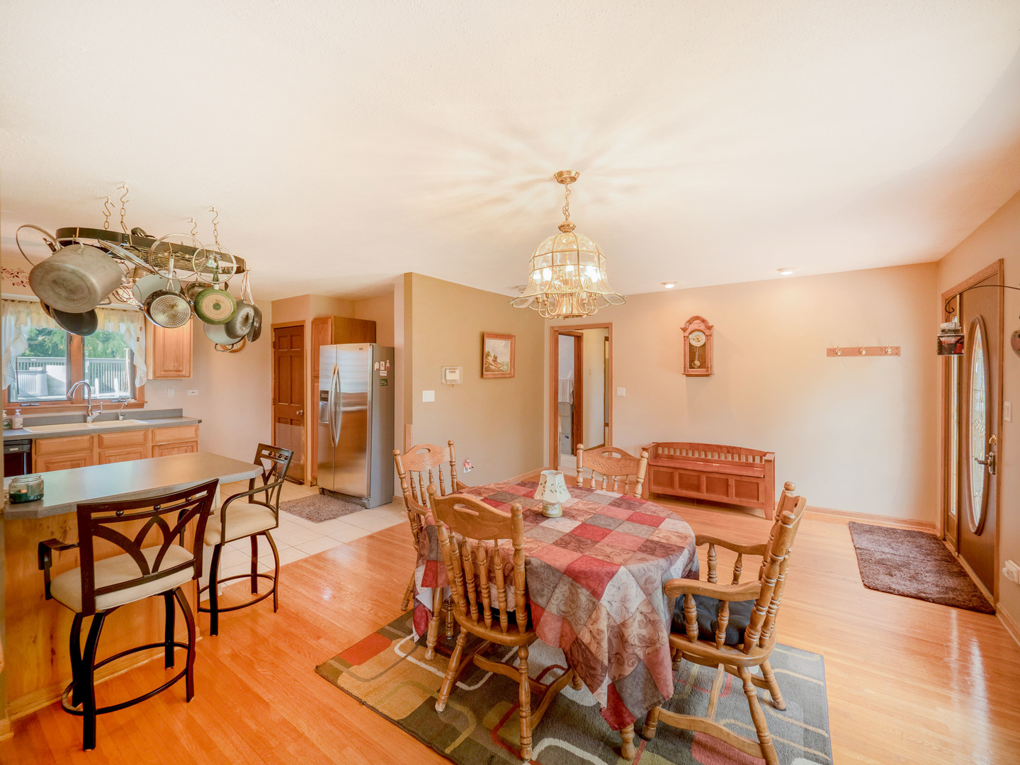 20806 Lembcke Road Harvard, IL 60033 - Photo 13 of 44 a view of a dining room with furniture and chandelier
