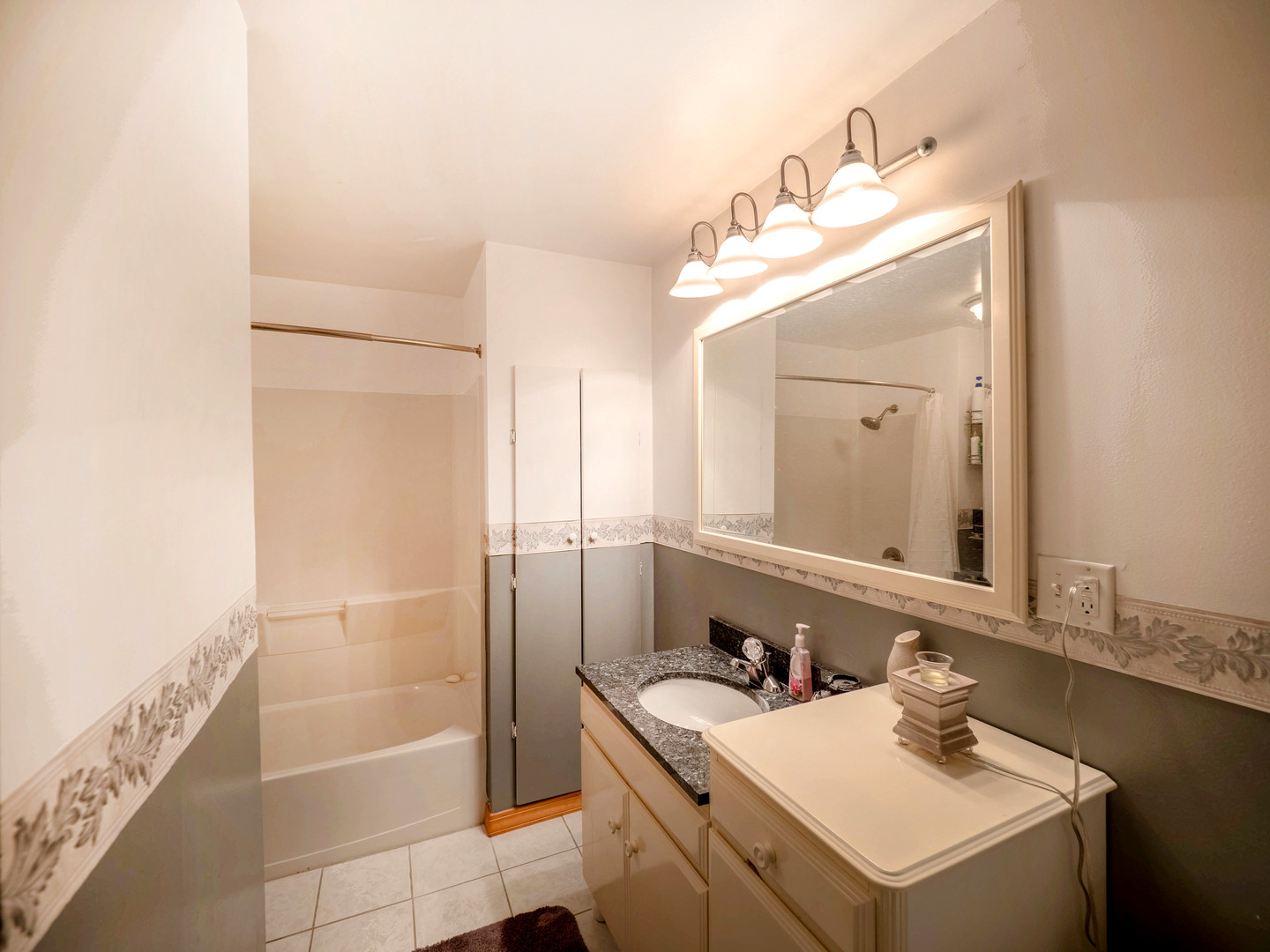 20806 Lembcke Road Harvard, IL 60033 - Photo 22 of 44 a bathroom with a sink and a mirror