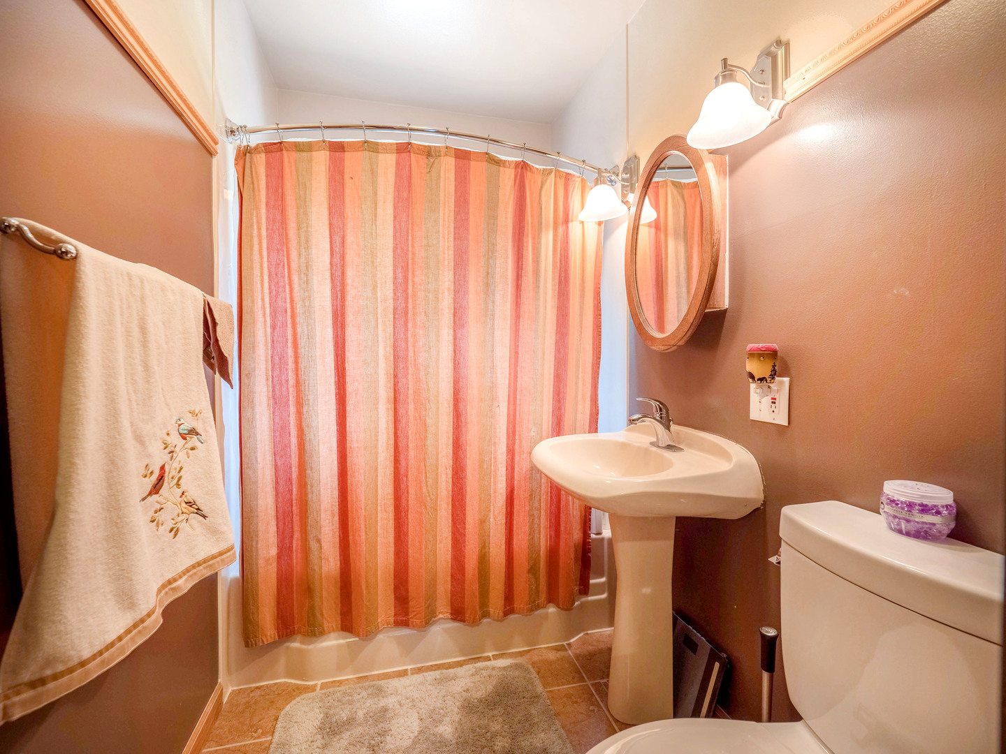 20806 Lembcke Road Harvard, IL 60033 - Photo 24 of 44 a bathroom with a sink a toilet and shower curtain